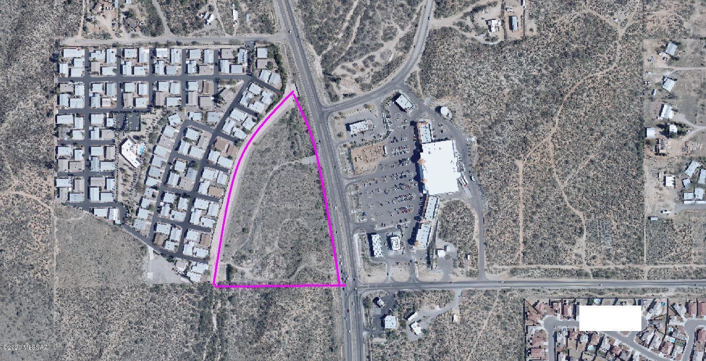Corner of Main & Main in the suburban Tucson town of Catalina.    ALl utilities are either on site of adjacent.  Great site for Retail, Office Multi-Family,...   Excellent mountain views.    This corner is the end of the funnel for all traffic from central Pinal Co, all of Catalina and Saddlebrooke to Tucson.   ALTA survey is complete.   A grandfathered,  20' high, dble sided sign is on site.