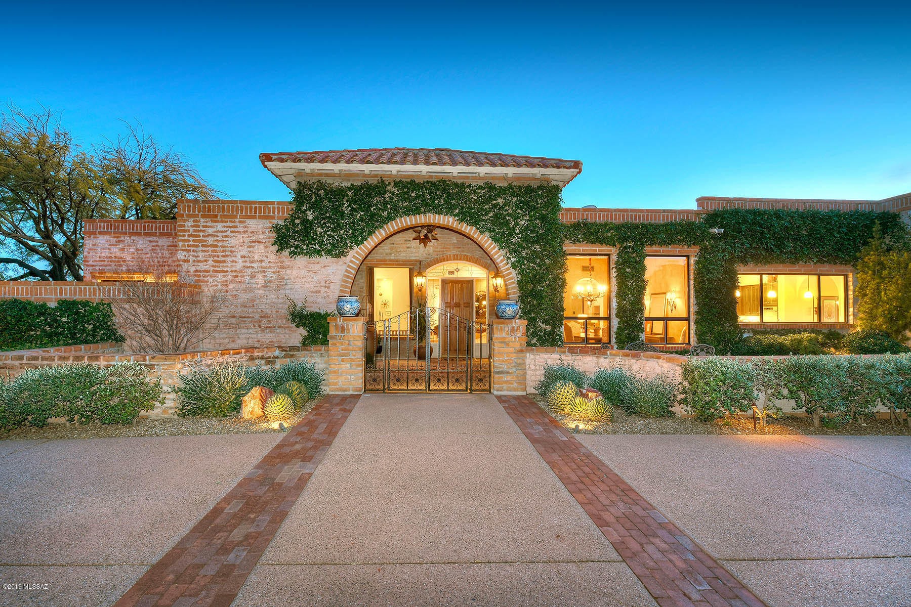 GRACIOUS AND ELEGANT TERRITORIAL ON 1.3 ACRES W/MAGNIFICENT CITY & MOUNTAIN VIEWS IN PRESTIGIOUS
GATED CATALINA FOOTHILLS EST. #10. BEAUTIFUL FRONT COURTYARD, EXQUISITE LIVING RM W/ DRAMATIC FIREPLACE,
HIGH BEAM CEILINGS, LG PICTURE WINDOWS, BUILT-IN BOOKCASES, FORMAL DINING RM, LIGHT & OPEN KITCHEN W/GRANITE COUNTERTOPS, LOVELY BREAKFAST ROOM, LARGE FAMILY ROOM W/ FIREPLACE, BEAUTIFUL TILE FLOORS, 4 BEDROOMS PLUS 5 REMODELED BATHS, MASTER SUITE W/SITTING AREA, LUX. BATH W/GRANITE COUNTERTOPS & TRAVERTINE TILE FLOORS,  INDOOR AND OUTDOOR SHOWER, 2 WALK IN CLOSETS AND PRIVATE ENTRY TO THE REAR PATIO. ENJOY THE
LUSHLY LANDSCAPED BACKYARD W/ CHARMING COV'D PATIO, POOL,SPA, FIREPLACE,BBQ, 3 CAR GARAGE, DIST. 16 SCHOOLS AND VIEWS, VIEWS, VIEWS.
FLR PLAN LOCATED UNDER PHOTOS, VIRTUAL TOUR
