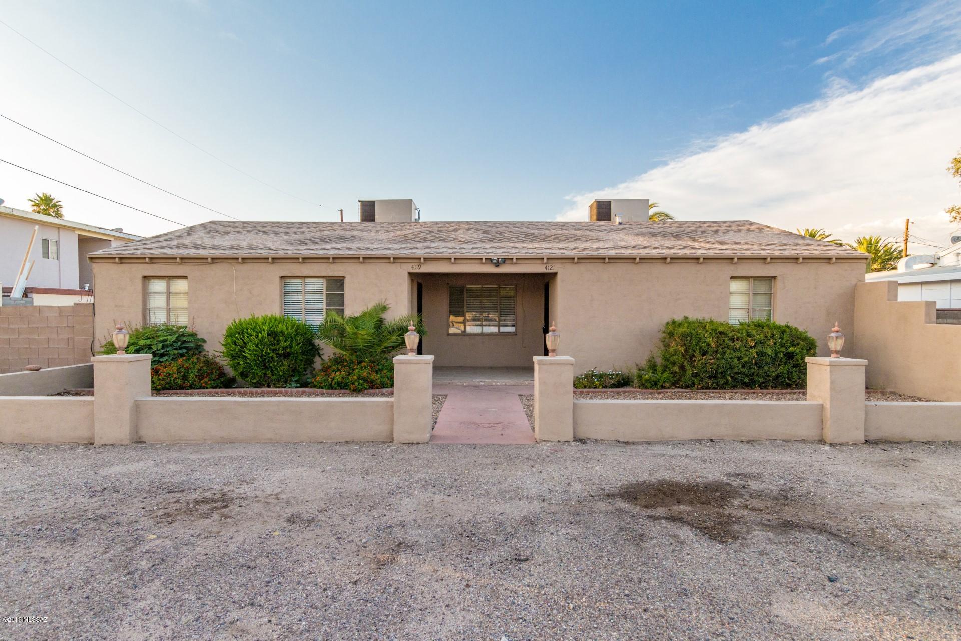 Fully remodeled and meticulously maintained duplex with land/lot opportunity located in desirable neighborhood in the heart of Tucson! This investment property features a 1bed/1bath and 2bed/1bath centrally located and close to Randolf Park. This property was completely gutted and remodeled in 2008 with brand new kitchens, bathrooms, flooring, lighting, appliances, gas water heaters, A/C units, and new roof in 2011. The exterior was stucco'd and painted with new block wall installed aroundentire perimeter. Rare bonus land/lot available in rear of property has been cleared and ready to build your next investment opportunity for additional cash flow! Easement available for rear lot and both lots have been fully surveyed. Seller just had grout professionally cleaned. Improvements that have been made are: $55, 000 remodel in 2008 that includes stucco and paint to exterior, block wall around perimeter with separate yards for both units, newtile flooring throughout, complete kitchen and bath remodel with maple cabinetry, newlighting fixtures, new hardware, doors, appliances, plumbing fixtures, water heaters, new A/Cunits new roof in 2011 main sewer line to house replaced in 2012 main water line replaced in 2012 laminate flooring (carpet removed) installed in all bedrooms in 2012 removal of large overgrown trees in 2013 security doors installed in 2013 A/C units have been serviced yearly including 2019 Back lot is included in the sale.