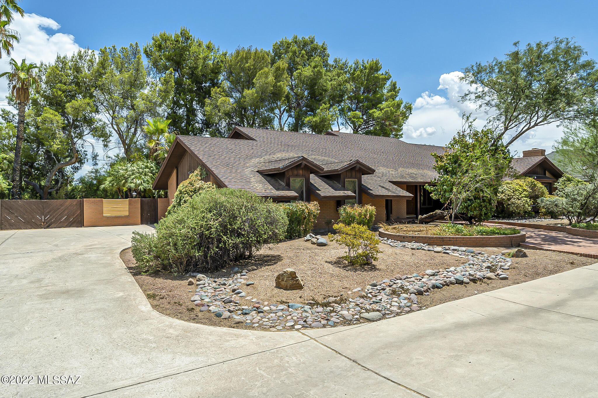 Here's your opportunity to live in the highly desirable Tucson Country Club Estates. This home has great bones, awaiting a new vision. As you enter the foyer take in the brick fireplace, cathedral ceiling and beautiful exposed wooden beams in the family room. The open loft that overlooks the family room is a great space for a gaming room or office. This welcoming floorplan with its spacious kitchen, formal dining room and living room, is perfect for everyday living and entertaining. The huge master suite is a private oasis, with fireplace and plenty of space for a loveseat or chairs. Enjoy evenings and weekends barbecuing under your backyard patio and relaxing in your pool or spa. This home must be seen to truly appreciate its potential!