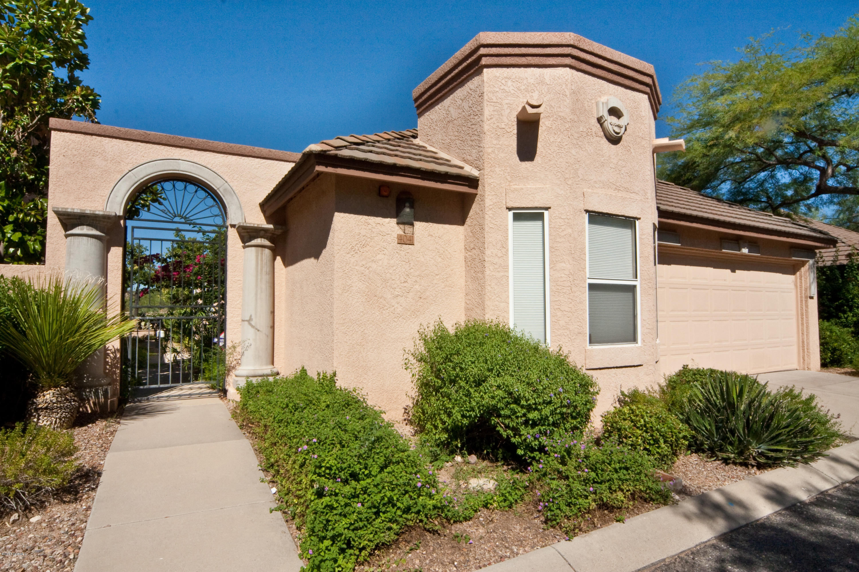 Wonderful Guard-gated community of La Paloma! Beautiful renovation with timeless appeal showcases 3BR/2BA home has 1,485 sf with attached 2-car garage. Scenic Mountain & City Views! Special features with Travertine stone floors and upgraded cabinetry w/granite counters. Overlooks Finger Rock wash for added backyard privacy is a premium location. Spacious floor plan has high ceilings and fireplace to enjoy chilly evenings! All appliances included and alarm installed. Gated community pool/spa to enjoy and cool off on warm summer days. See virtual tour for additional photos of property. Well-maintained and exceptional location!