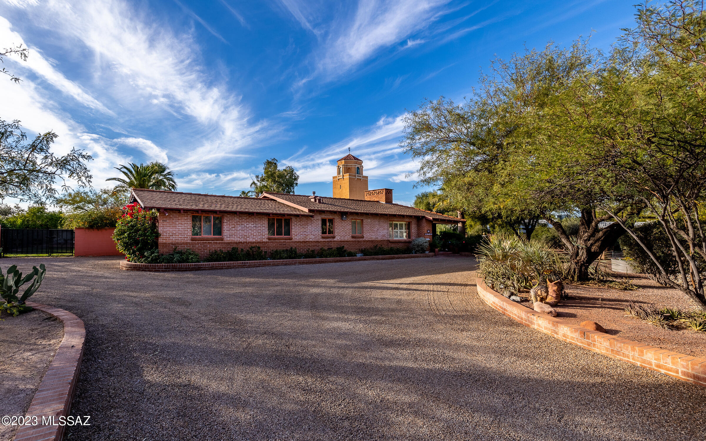 Historic Estate in Colonia Solana is the perfect blend of charm, privacy, and space. From manicured gardens to unique interior features, this home has it all. The property's exterior is a testament to attention to detail with beautifully landscaped garden areas, adorned with colorful flowers, soothing fountains, fruit trees and a spacious turnaround driveway that offers both convenience and aesthetic appeal. Stepping inside, you'll be immediately captivated by the living room's distinctive wood-planked vaulted ceiling, a rare and enchanting feature that sets this home apart. Relax by the double-sided wood-burning fireplace, which elegantly separates the living and dining areas, creating a cozy and inviting atmosphere. This generously proportioned home features 4 spacious bedrooms providing ample room for both family and guests. Additionally, there's an inviting den area that can be tailored to your lifestyle needs. The vast family room is a delightful space filled with natural light, perfect for family gatherings, hosting parties, or simply basking in the sun. It includes extra cabinetry, offering versatile usage as a coffee bar, cocktail bar, or a convenient spot to offer snacks to little ones returning from the pool. The charming French kitchen boasts butcher block countertops, a gas range, and an antique butcher block island, creating a warm and functional culinary space. All three bathrooms in this home exude vintage charm, adding character to the property. The Primary Suite is a private retreat, complete with a walk-in closet and additional cedar storage, ensuring a clutter-free environment. Step onto a lovely patio directly from the Primary Suite, providing a tranquil outdoor oasis to start or end your day. The property offers additional parking, ensuring convenience for all your needs. There's ample space for recreational activities, whether you envision a TV area, room for your toys, or even the addition of a pickle ball or sport court, or add a guest house your family will love. The private backyard is a sanctuary, featuring a refreshing pool, an above-ground jacuzzi, and numerous patio vignettes, perfect for relaxation and entertaining. For the hobbyist, the backyard includes three extra storage sheds, one of which is equipped with a TV and wall-mounted AC, creating an ideal space for weekend projects or hobbies. This historic grand estate in Colonia Solana is a rare find, blending historical charm with modern amenities. Don't miss the opportunity to make it your own and enjoy the perfect mix of comfort, privacy, and space.