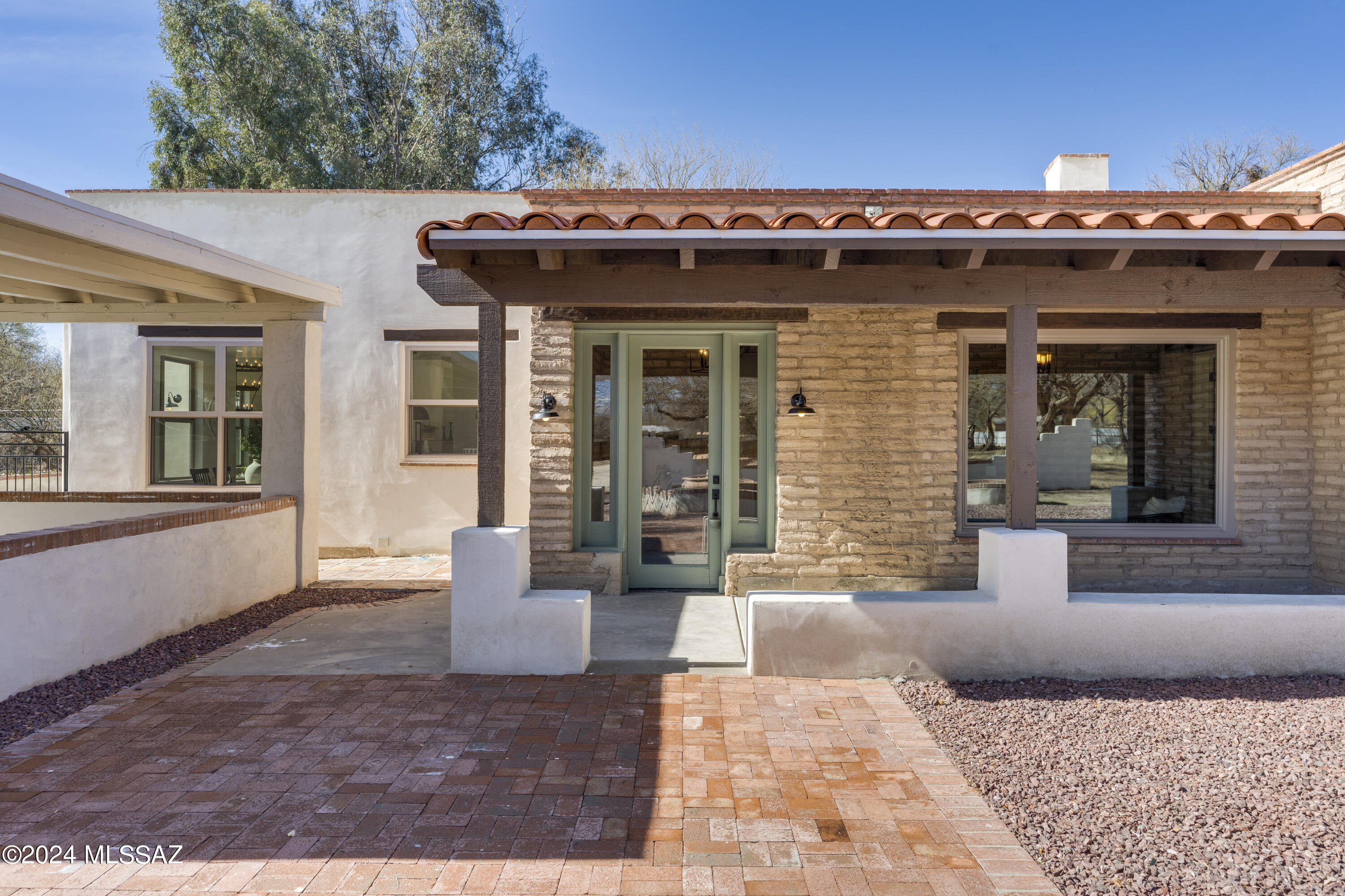 UNDER APPRAISED VALUE. DEAL OF THE CENTURY! Welcome to the estate of your dreams!  This home is truly unique with so much character. Functional floorplan and ample room along the treelined property tucked at the end of a private dirt road... this home offers 5 beds, plus a den/office, 5 bathrooms, three living areas, two wood burning fireplaces, beautiful adobe walls, wine storage, pool and four patios.  Completely private, this home features ample upgrades: gourmet kitchen with chop block countertop, pot filler, prep sink, large island, eat-in dining, vaulted ceilings, large windows, and custom lighting throughout. OWNER/AGENT Primary suite overlooks nature with arched walk-in shower, large soaking tub, double marble vanities, two walk-in closets, and it's own fireplace.  The split floorplan is ideal for those who like their space. The back wing makes an ideal multi-generational living space or kids wing.  Host summer parties by the pool that was completely redone in 2021.  There is zoned heating/cooling, no carpet on main floor, spacious laundry room, connected to sewer, no HOA, horses allowed, mountain views, and room to roam!  This is a MUST SEE home.  Perfect for a large estate, AIRBNB, or multi-generational home.