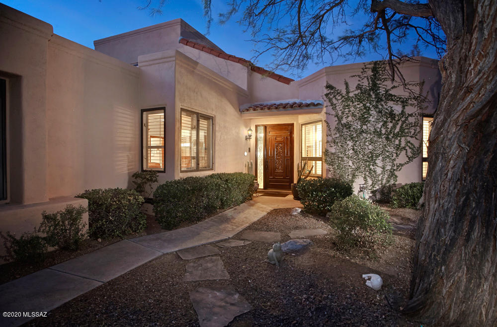 SEE VIDEO AND DRONE FLYOVER UNDER VIDEO TAB.   THIS 2886 SQ.FT. 4BR/3BA PROPERTY AWAITS THE DISCERNING BUYER. THE GOLF COURSE PROPERTY IN GATED LA PALOMA,  IS PERFECT FOR FULL OR PART TIME RESIDENTS LOOKING FOR EASY LIVING.   PLENTY OF ROOM TO ADD A  POOL AS SHOWN IN THE PHOTOS.   THE GREAT ROOM FEATURES SOARING BEAM CEILINGS, CUSTOM FP W/MESQUITE MANTLE & SLIDING DOORS OPENING TO SPACIOUS PATIO W/STUNNING MOUNTAIN VIEWS!  THE KITCHEN HAS VIKING SS APPLIANCES, GRANITE COUNTERTOPS, FARM SINK,  A BAR W/WINE REFRIG & MORE. ENJOY THE 1ST FLOOR MASTER BR SUITE W/CUSTOM TILE SHOWER, DOUBLE VANITY AND TONS OF CLOSET SPACE. GUEST ROOM/OFFICE HAS ADJACENT BA W/A STUNNING MESQUITE VANITY.  GUESTS WILL ENJOY PRIVATE UPSTAIRS BR SUITE W/BALCONY & MTN VIEWS.