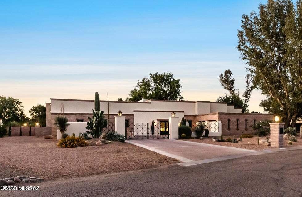 Range Pricing - Seller will accept and/or counter offers between $1,800,000 & $1,900,000. Completely remodeled only 1 wall is original. Location, Location, Location, Located on the 16th & 17th Fairway of Tucson National Estates & Country Club. Over 3700 Sq. ft. of Exceptional Living. 4'x4' Italian  Porcelain tile throughout. Custom & Modern Finishes. 12' Ceiling Heights. Indoor & Outdoor Living. Gated entry, .76 Acres. Kitchen Boasts New Cabinets, Quartz counter tops, New Appliances, Oversized Island, Pantry & more.  Owners Suite has Golf Course & Mountain Views, Luxurious Bathroom, Dual Vanities, Walk In Closets. All rooms are En Suite. Bonus Room currently used as an office. Outdoor Living w/Fireplace, pool and oversized covered patio. Tucson golf course is your extended yd HOA is $19 mo