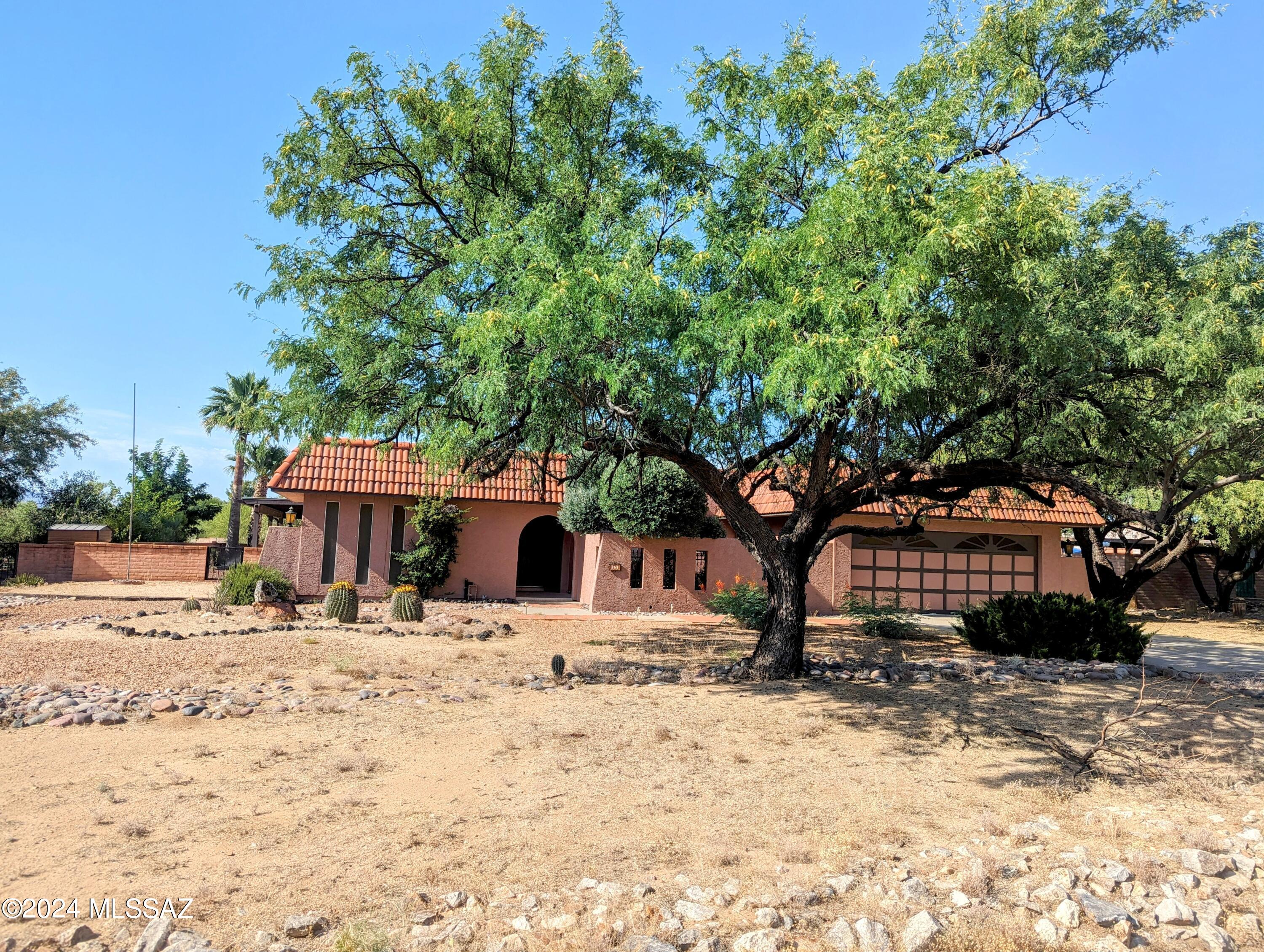 A RARE find in Green Valley!!! NO HOA, NO GVR, AND NOT AGE-RESTRICTED!! This 3 bed, 2 bath home has so much potential! Situated on a large lot, has a sparkling pool, gorgeous mountain views, a south side wrap around porch, and waiting for someone to make it their own. There are three living spaces, which are perfect for entertaining or using as a home office or gym. Being sold as-is through the trust, but the pool is being maintained and the trustee believes all major components of the home are in working order. The landscaping is being cleaned up on the 15th and it'll show you just how pretty this property is.