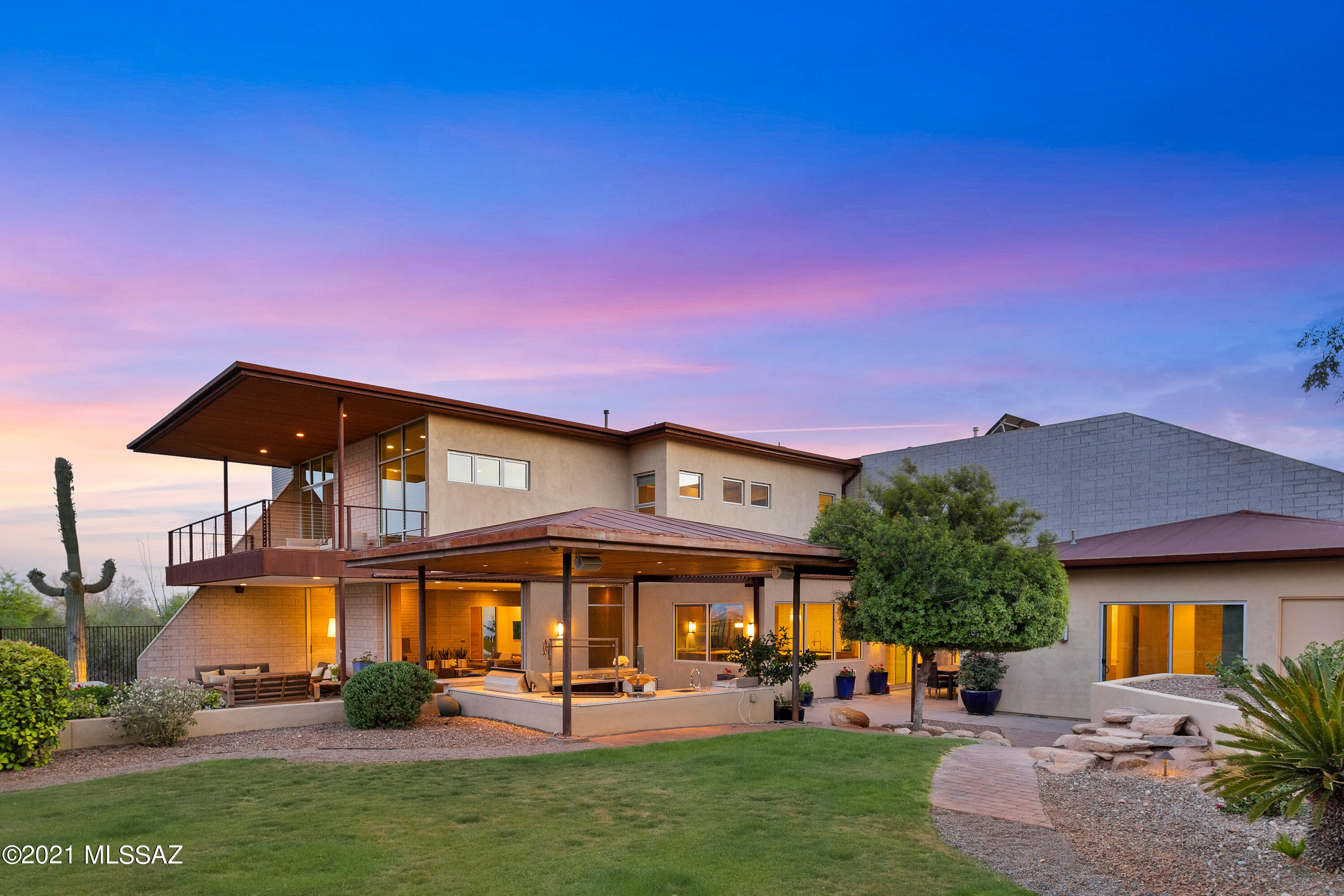 Magnificent Industrial Modern masterpiece by architect Randel Jacob, located in exclusive Eleven Arches in the heart of the Catalina Foothills. Fabulous mountain, city, sunrise and sunset views. Only the finest materials incorporated in this one of a kind contemporary home. Incredible chef's, or entertainer's dream kitchen featuring Wolf six burner gas range, plus  grill and griddle, Gaggenau oven and Combi steam oven, Miele built-in espresso maker and Thermador Columns refrigerator and freezer. Counter tops feature Nambia Sky Quartzite, Basaltina, Vertrazzo throughout the home. Custom cabinetry and paneling, to include rift cut white oak, ribbon cut mahogany, birch, quarter sawn and wenge. Site finished walnut, Silver River vein cut travertine and polished concrete floors throughout. One bedroom and en-suite bathroom downstairs. Lavish master suite with steam shower and deck over-looking wonderful mountain and city views. Up stairs loft, library, or sitting room overlooks second view deck with amazing city views. Long driveway. Plenty of room to add a pool in several different locations. Truly a fabulous custom home in a terrific central foothills location.