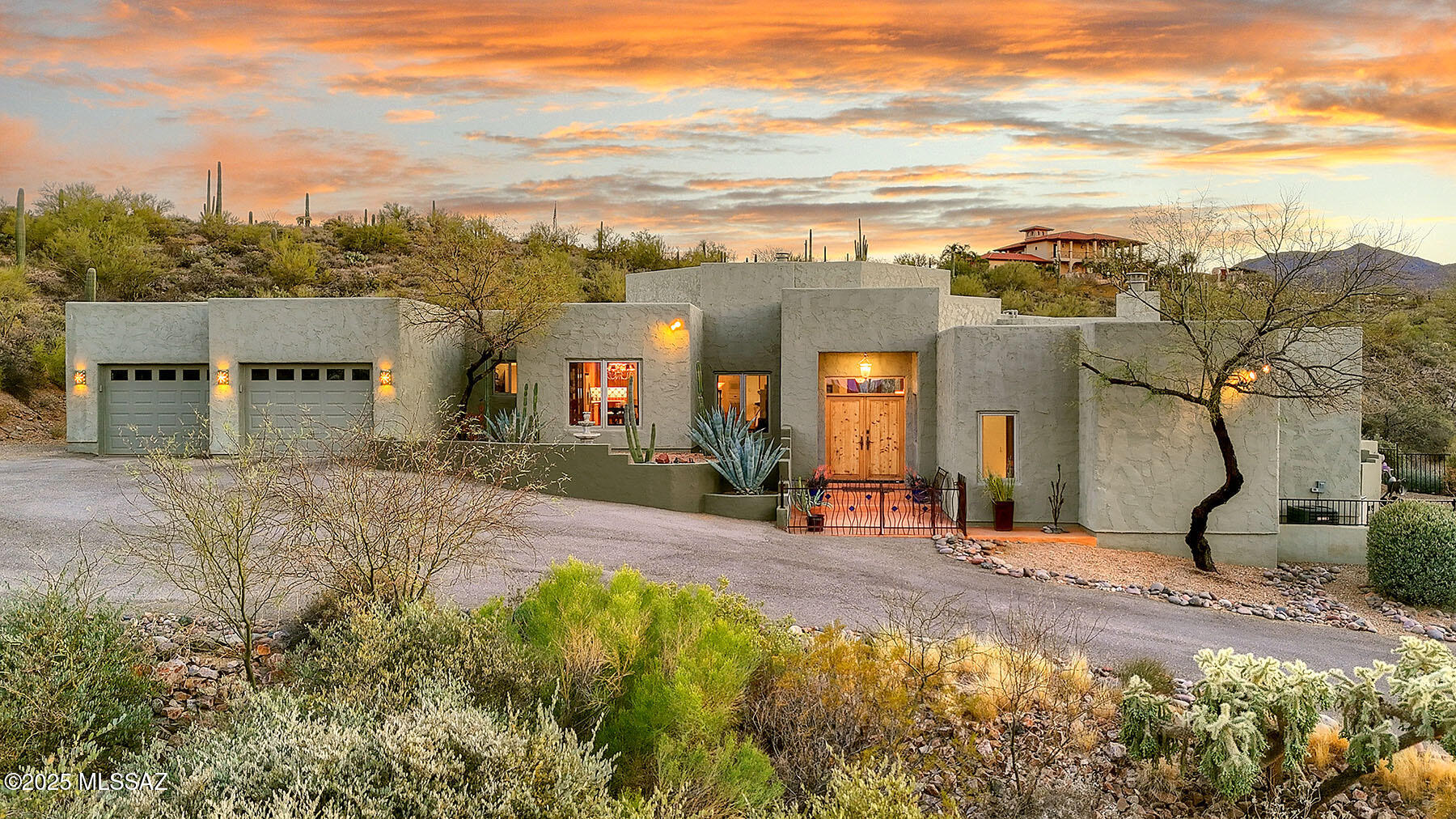 Your very own magical sanctuary awaits you, nestled on 4.06 acres in the foothills of Saguaro National Park West, with magnificent views inside and out, abundant wildlife, lush desert surroundings and all the amenities you expect in a southwestern style home.  Inside fin 2,922 sq., find a lovely open floor plan, great room with fireplace, spacious remodeled kitchen, updated appliances, fixtures, counter tops, back splash, lots of custom cherry cabinets and counter space.  The remodeled primary suite features sitting area, 2-way fireplace, bath with dual sinks, spa tub and separate shower offering new fixtures, tile, vanity and mirrors.  Find two additional bedrooms plus office/bonus room, storage/workshop, dual cooling replaced in 2020 and 2024, extended garage and water softener. New roof in April of 2019, new asphalt driveway in 2021, renovated PebbleFina pool, retractable sunscreens on west patio, new water heaters in 2021, detached shed/workshop.  A serene desert oasis with spaces for meditation and contemplation, including butterfly and zen gardens, gorgeous negative edge pool with fountains, deep covered patio, open deck with fireplace for viewing sunsets and starry nights and easy access to Saguaro National Park West.