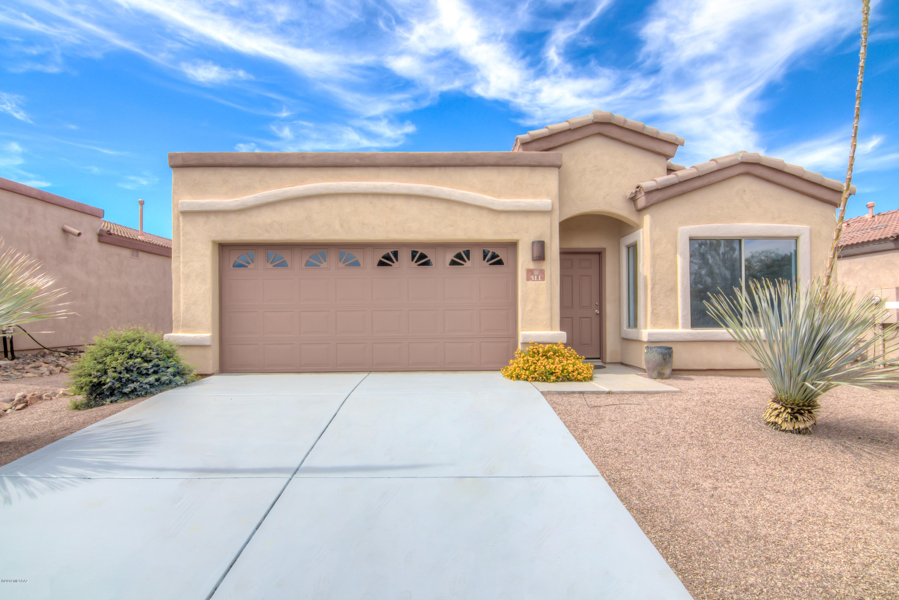 MOVE-IN READY!! This lovely 4 bedroom, 2 bathroom home is in a gated community, and has curb appeal! Inside you have stained concrete floor in the formal living/dining area. Kitchen has brand new s/s appliances. New carpet, paint, and roof has been inspected! Master Suite has a walk-in closet, garden tub, and executive height counters with dual sinks. Low maintenance landscape with fruit trees. Community pool and park is within walking distance. Come get this one before its gone. Will not last long!