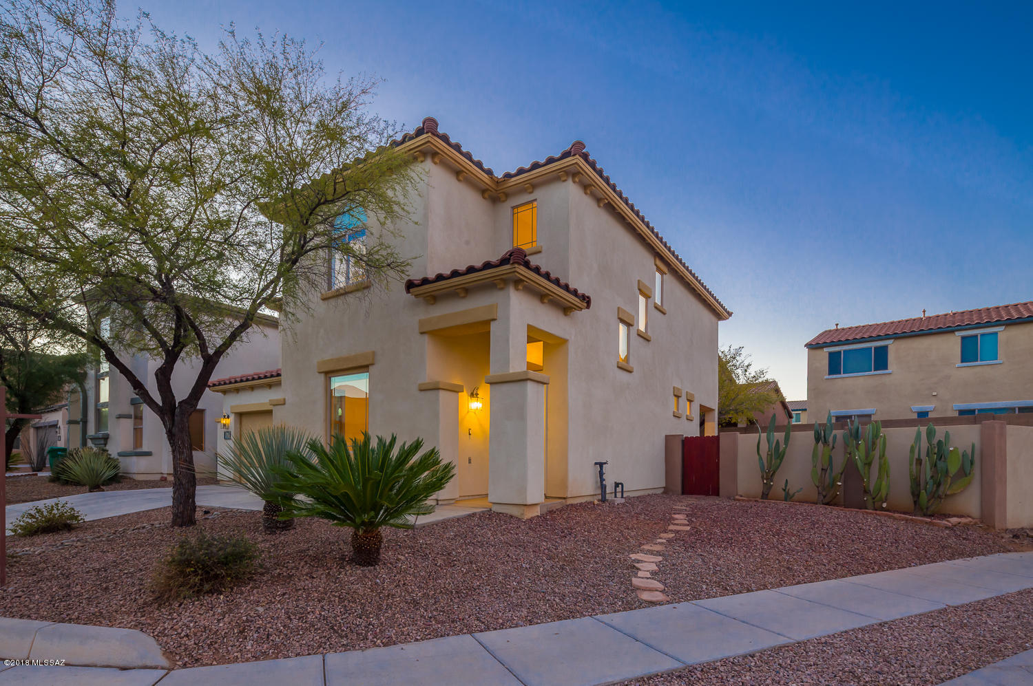 Beautiful Corner lot home in Rancho Sahuarita, 4 large bedroom 3 bathroom,  upgraded Pulte Toledo model. Light and bright, just painted with neutral colors, brand new wood floors in living and family rooms, surround sound prewire, kitchen has plenty of storage,  light oak cabinets,  and spacious pantry , gas stove. Upstairs laundry with extra storage cabinets .Fans in every room.  Master bath has dual separate sinks. Large master closet. Hall bath with double vanities. Back yard has perfect space ready to entertain and very easy to maintain. Block wall.Tile Roof.  Community amenities :You'll have access to three pools ,splash area, nine parks, trails and paths for walking and cycling, and Club Rancho Sahuarita, resort-style recreation center for the whole family