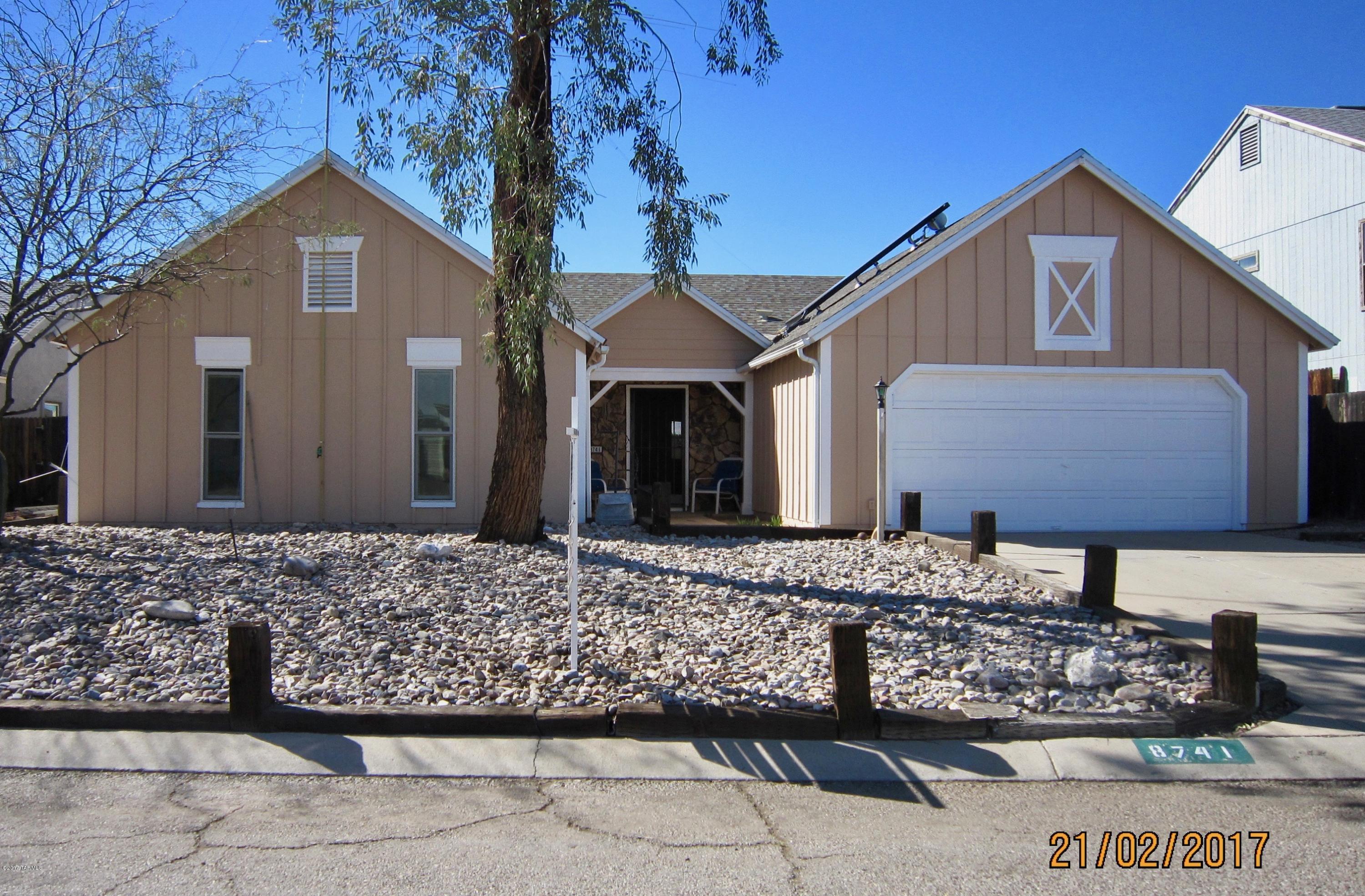 Four bedroom, Two full bath 1907 Sq. Ft. home with a lovely sparkling, self cleaning Swimming Pool and large finished double garage. Large open floor plan with high vaulted ceilings. Family room with beautiful Oak Wood flooring installed. Complete Interior and Exterior re-painted within the last 2 years. This home is very near Schools. Solar heated water system with 80 gallon tank. Brick wood burning Fireplace in the Living Room. 10 year old, 30 year warranted roof. Dining area with a bright Bay Window. Large 32 foot Covered Patio. Built in personal safe 17in x 7in x 14in deep included. Garage door replaced 2 years ago. Food freezer in the garage is included. Tremendous value in this immaculate move in ready home. Pride of Ownership is visible everywhere.