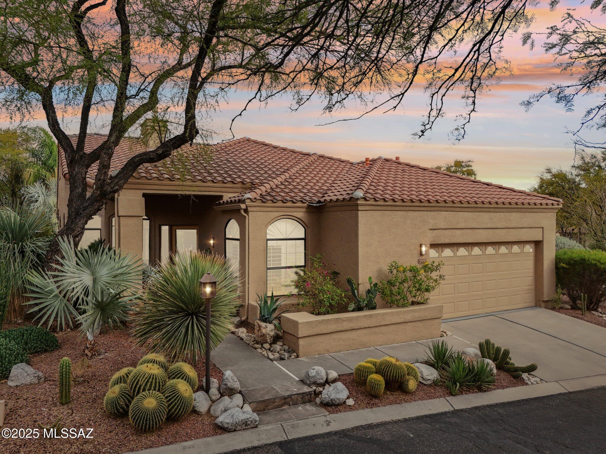 This exquisite golf villa on a private corner lot in gated Ventana Canyon offers luxury, space, and modern upgrades. The open floor plan features soaring ceilings, flagstone flooring, and a spacious great room with a stacked stone fireplace. The gourmet kitchen boasts maple cabinets, granite countertops, stainless steel appliances, a five-burner gas cooktop, and an island with bar seating. A split-bedroom layout ensures privacy, with a versatile third bedroom/den featuring an en-suite bath. The primary suite offers a soaking tub, custom closet, travertine floors, and backyard access. Hall bath recently renovated. Outside, enjoy a covered patio, pool, spa, outdoor kitchen, citrus trees, and lush landscaping. Recent updates include a new roof, owned solar, and more. Not to be missed!