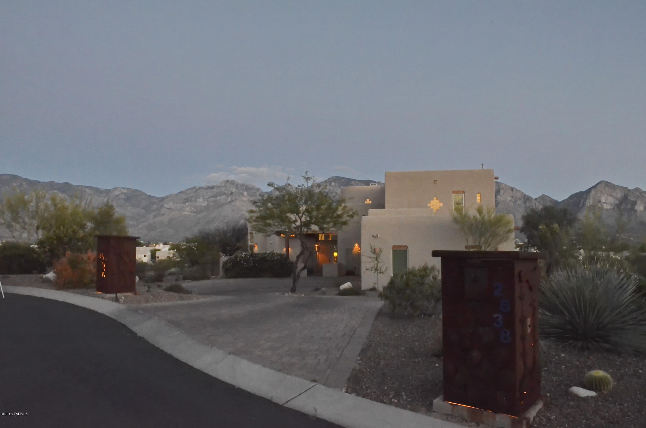 Fabulous, former developer/builder's own ridge top southwest contemporary. Home boasts full range Catalina Mountain views and wonderful city light views. Four bedrooms, three and a half baths. Wonderful diverse floor plan with many different options. Two family rooms downstairs, plus a terrific loft with many uses and fabulous views. Greatroom off the open kitchen with wood vigas and 14 foot wood ceilings. Huge windows bring the beautiful views and natural light into every room. Beautiful master suite with large sliding glass door to awesome balcony, amazing views, large master bath with over-sized walk-in shower and huge closet. Very private 1.86 ac lot, brick paver drive way, three zone A/C units, R40 Ceiling and R28 wall insulation with radiant heat barrier, dual pane, low E windows.