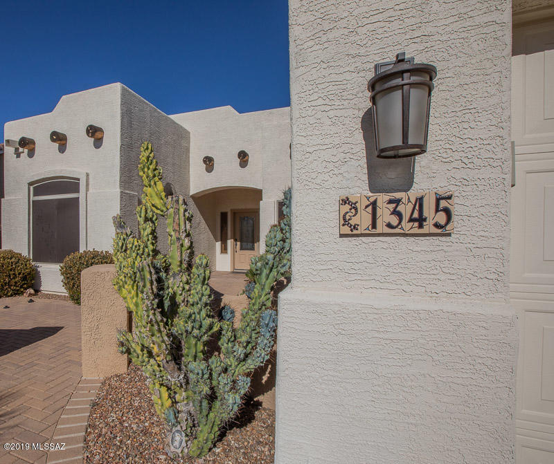 EXCEPTIONAL LIVING WITH GOLF COURSE, MOUNTAIN , SUNRISE AND SUNSET VIEWS GORGEOUS SANTA FE STYLE HOME EMBRACES THE BEST OF SOUTHWEST LIVING.   Inspired outdoor living includes front &  rear patio w/Ramada, outdoor Built-in BBQ, misting system (currently detached), outdoor TV, Kiva fireplace, fire pit & a place for a hot tub/spa.  Electronic screens. Interior design is amazing with a Kiva fireplace in great room, built-in cabinets in dining/den, lowered granite bar w/Blanco sink that creates an open concept & flows to the amazing out door living/entertaining space.   A cook's kitchen w/SS appliances, under mount Blanco sink, pull-out cabinets & more. 5 solatubes for added light.  French doors to patio from Master Suite, upgraded master bath, custom closet.  Surround Sound Split floor plan, extended garage w/ epoxy floor, 2 x 6 const., Built-in cabinets, R-19 Insul., Ceiling Insulation R-38.  PVC Landscape.