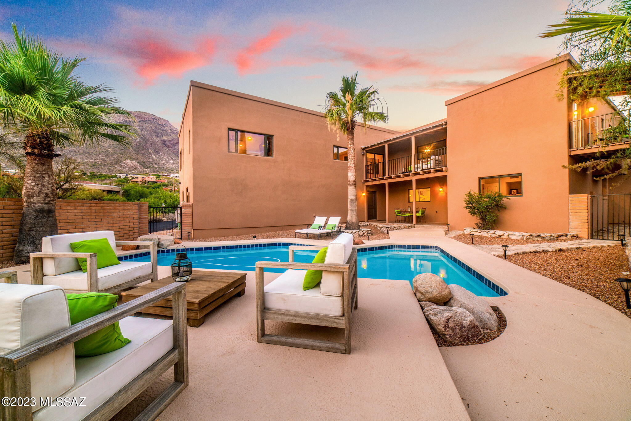 Located at the top of Swan near the base of the Catalina Mountains just North of Skyline Country Club sits this updated 4 bedroom plus den (could be 5th
bedroom), 3 bathroom home in sought after Coronado Foothills Estates. A courtyard entry leads to the entry foyer & formal living room w/natural stone
fireplace & 20' ceilings. A stunning gourmet kitchen w/granite counters, stainless appliances, island & walk in pantry. Upstairs you will find a spacious master
suite with a built in TV over the gas fireplace, city views, a large walk in closet, updated bathroom w/soaking tub & a private covered North facing patio with
spectacular mountain views. Also upstairs, you will find two additional bedrooms, a shared bathroom & huge loft area. PAID Solar Panels, low electric bills.