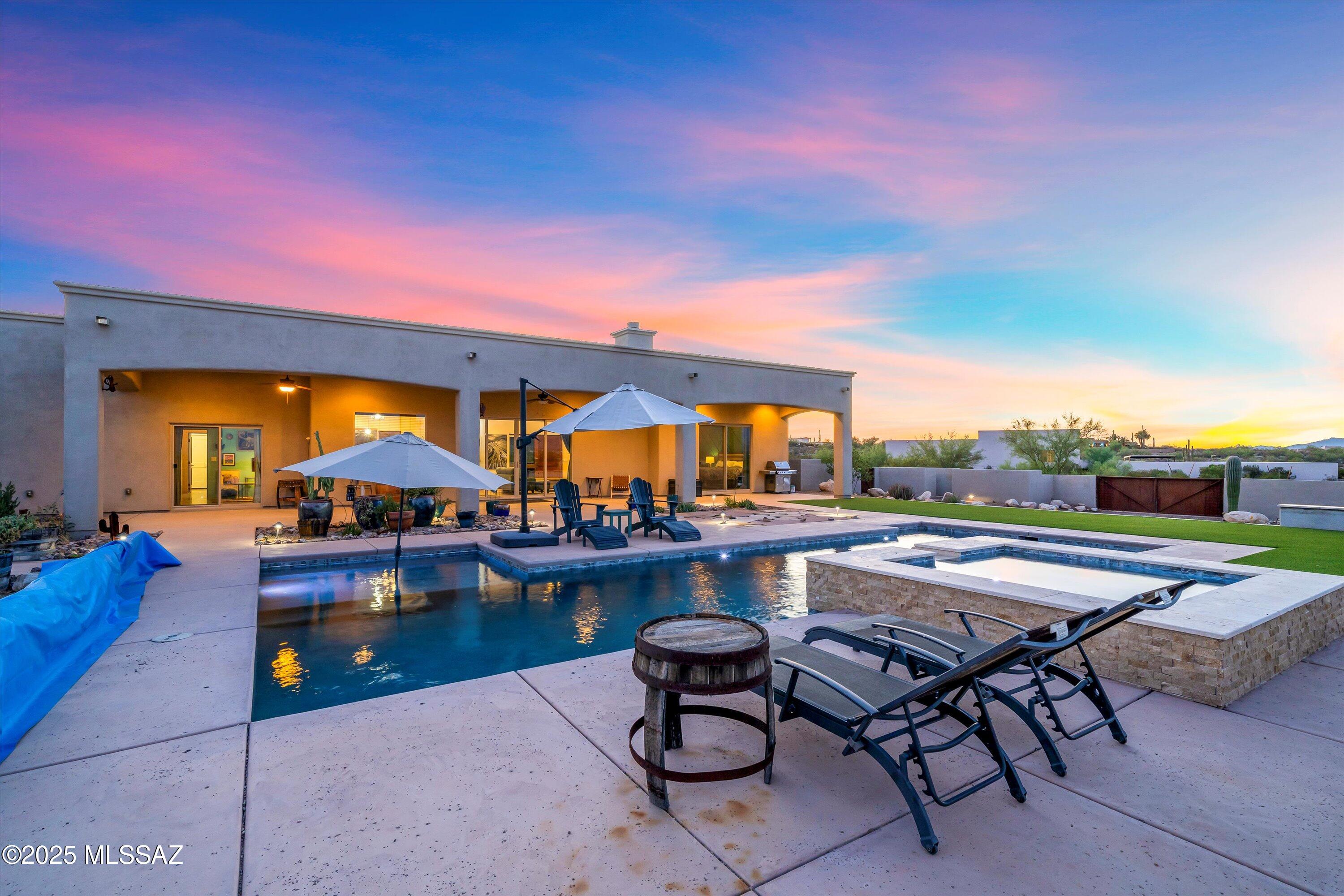 Once inside the beautiful gated community of Las Rocas you feel the exclusivity of the community and the grandeur of the views of the majestic Catalina peaks that lay in front of you. That same view is maximized throughout this home and, as you will see, the great room has an expanse of glass that frames the view from the kitchen, living room, and dining area, trusting in the mid century concept of bringing the great outdoors to the living area and the heart of the home. The owner?s suite also takes advantage of the Eastern view of the mountains and has an expansive view of the mountains that you wake up to every day. Walk out to the pool and you see blue water, white clouds, and the purple mountains majesty that makes this Southwest so great.