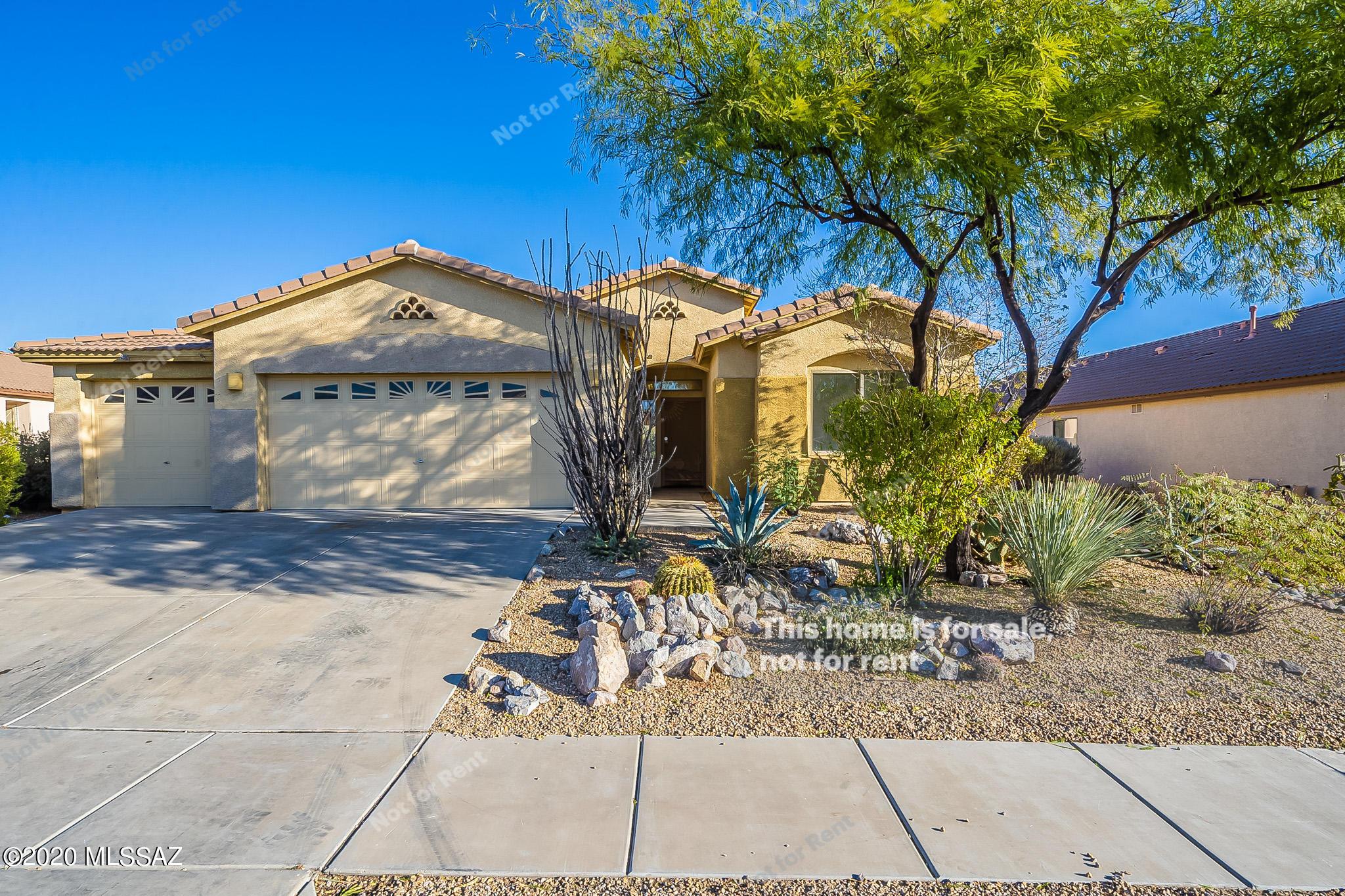 This Tucson one-story home offers granite countertops, stainless steel appliances, tile flooring, a three-car garage, and backs to natural space with view fencing. This home is vacant and cleaned regularly.