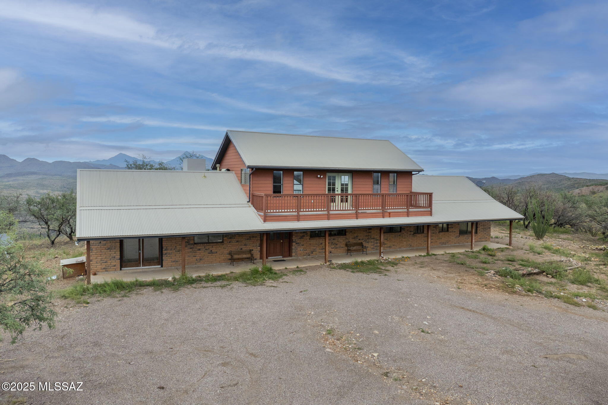 Top of the world views from this classic ranch style home.  3069SF with 2 bedrooms, loft with a bath, extra room which could be used as an office.  Private well and horse facilities with tack room/hay storage and corral.  Easy ride out to state land with lots of trails to explore.   This is every cowboy's dream house.