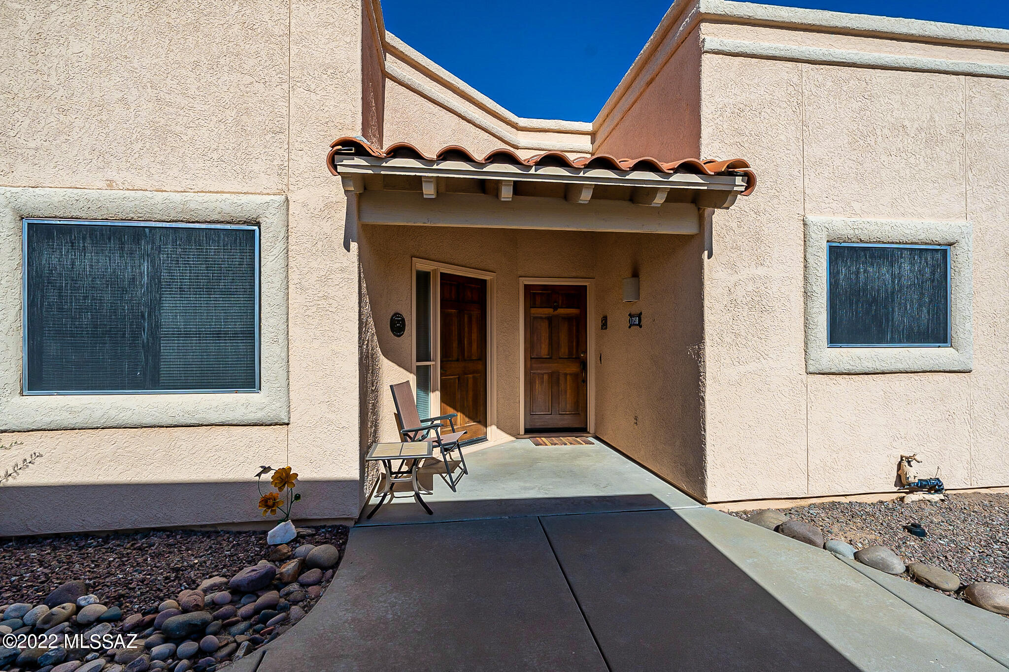 A great opportunity to have your own winter retreat instead of paying rent. Located in Cortina Villas, this town home has a second bedroom with private entrance so you gain income even while you occupy the main unit.  An open concept floorplan with high ceiling and large windows and sliding patio door that add a tremendous amount of natural light into the home. The private back patio has wonderful views of natural desert and the San Ignacio Golf Course far below in the distance. It is also conveniently located near restaurants, golfing and Green Valley Recreation Centers. Completely furnished so it is ready the moment you get the keys!  Come enjoy the lifestyle that Southern Arizona has to offer!