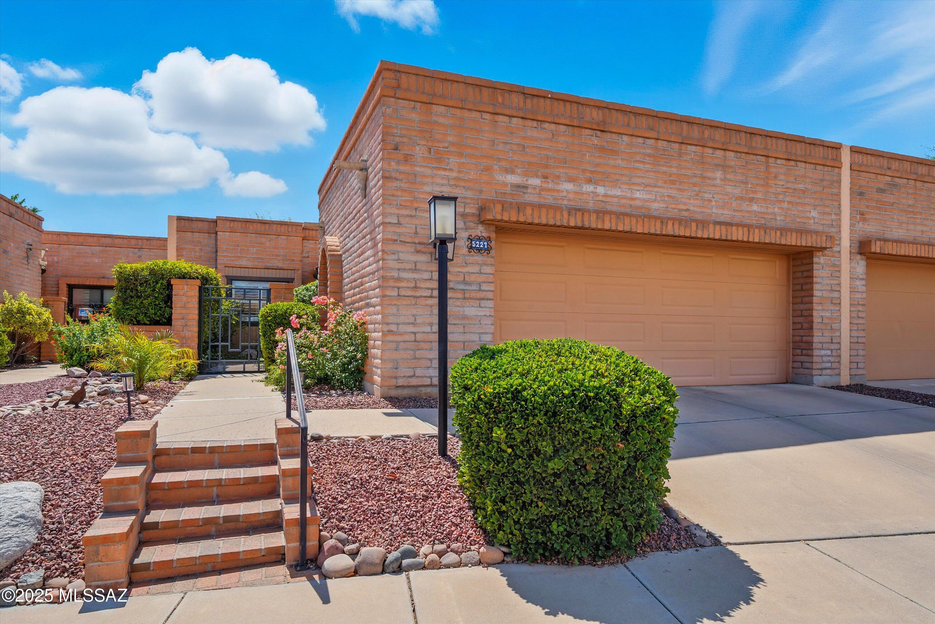 Welcome to 5227 N Via Agrifoglio! From the moment you step though the front door you will feel at home.  Beautifully updated kitchen with everything you'll need including a built-in desk area, SS appliances, quartz countertops, and stunning mountain views. The kitchen opens to the spacious Great Room with a gas fireplace. Primary suite offers access to the backyard, double vanity, walk-in shower & a large closet for storage. The second bedroom is great for guests or an office.  Very private backyard with sunset and city views! The popular Fairfield community offers a heated pool & tennis court.  Shopping, restaurants, grocery store, Sabino Canyon park and much more all located within minutes of the Townhome.  CALL FOR SEASONAL RATES & AVAILABILITY.