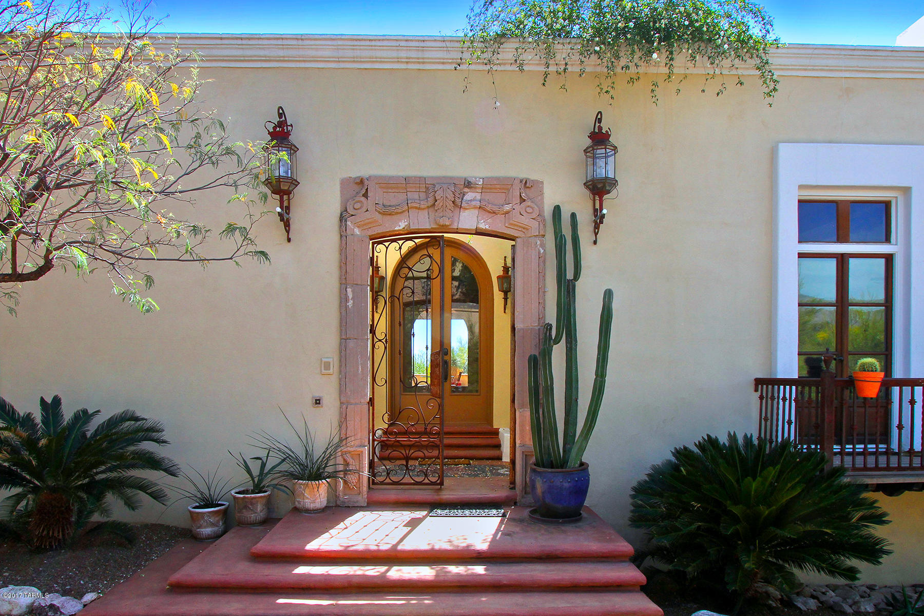 This Spanish Colonial boasts ''Old World Tucson'' with so many treasures found throughout this remarkable architecture. Inspired by a home in Guanajuato, Mexico, this home is filled with historical artifacts from Mexico, Arizona & New Mexico. The hilltop lot overlooks the city lights - gaze across the Tohono Chul-like backyard with many varieties of plants & cactus. This lot is private & offers spectacular sunset views as well as sparkling lights of Tucson from the massive tile covered & uncovered patio! This home was recently updated & restored to the splendor of yesteryear! Lots of history here with private patios, gardens, wood beamed ceilings (beams from old El Conq. Hotel), yet updated appliances & mechanical systems for efficiency. This is a ''must see'' at night-bring the telescope. Bring the telescope!