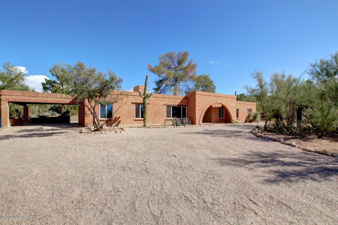Floor to ceiling contemporary remodel on this Santa Catalina Estates 4 Bed 2.5 Bath on .90 acres of natural desert land. Great views of the Catalinas. All New Wood plank tile,new paint and custom lighting. Spacious Great room floor plan with with many large windows and lots of natural light. Gourmet kitchen with dark wood cabinets, combination butcher block and granite counters, custom island with gas stove and SS appliances. Living room with stacked stone fireplace and HUGE great room with easy and direct access to pool and kitchen. A spacious master suite with private access to yard, large walk in closet and barn doors. Master bathroom has dual sink vanity, large walk in shower with rainwater shower head. Backyard has pool and great mountain views. Small Pets subject to owner approval.