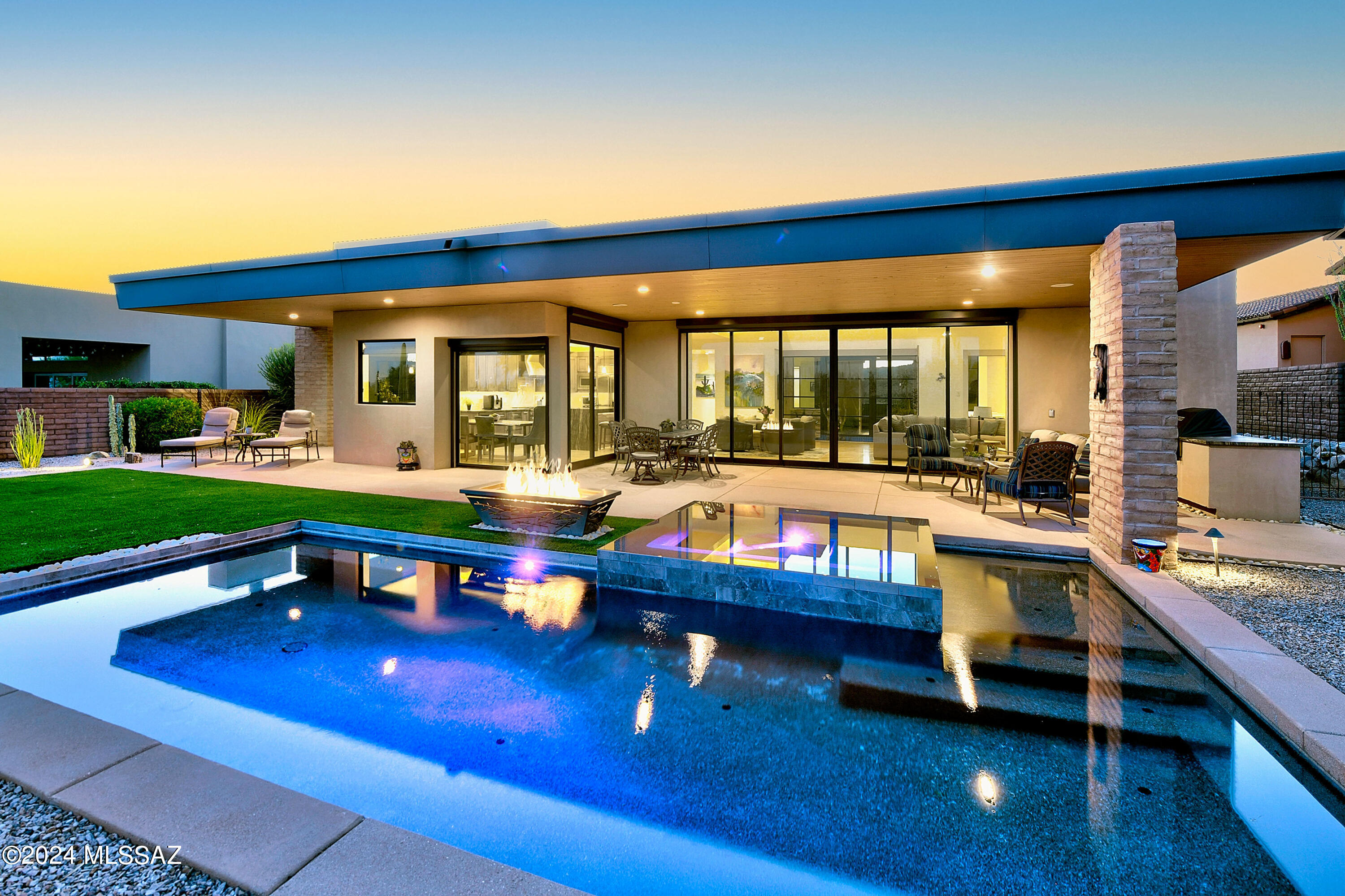 *WELCOME TO THE RITZ**ENJOY ALL THE WONDERS OF RESORT LIVING AT HOME! THIS DESERT RETREAT COMBINES MODERN ELEGANCE W/BEAUTY OF SONORAN DESERT! *ALL ''RITZ CARLTON CONCIERGE'' SERVICES *ARE INCLUDED*... POOLS, FITNESS CTR, SOCIAL EVENTS & JACK NICKLAUS GOLF CLUB MEMBERSHIP* EXQUISITE ESTATE IS NESTLED ON FABULOUS EAST ''GOLF COURSE'' LOT BORDERING NATURAL DESERT W/PANORAMIC MTN VIEWS IN EVERY DIRECTION! ENTER THE ''GATHERING ROOM'' - SOARING CEILINGS, MODERN FP DESIGN, CASUAL DINING/BREAKFAST RM & VANISHING GLASS WALL CREATES A SEAMLESS FLOW TO THE OUTDOORS! CHEFS KIT- FILLED W/COMMERCIAL GRADE APPLIC, QUALITY CABS & ''WATERFALL'' LEATHER QUARTZITE CTRS! RESORT STYLE BKYD...HEATED POOL , INFINITY SPA, TONS OF PATIOS, CHAT AREA W/FIREPIT, EN-SUITE GUEST CASITA + $25K GOLF MEMBERSHIP INCL**
