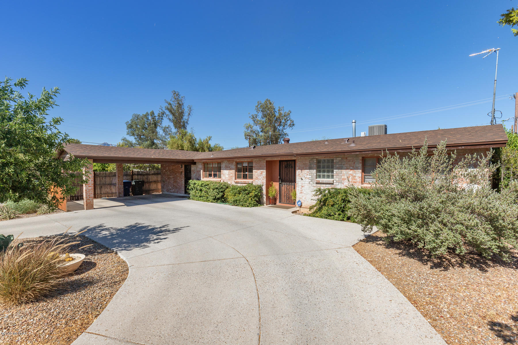 This  lovely Mid century home located  in historic Catalina Vista  home has been masterfully remodeled and retains its classic feeling. Wonderful chef's kitchen w/prep sink, & duel fuel stove, ss appliances white Bead board Cabinets w/black quartz composite w/river rock opens to a w large family room. Master bedroom has large walk in closet, beautifully remodeled bath with large shower and dual sinks. You will love the classic marble and granite finishes in the master bath. The backyard is your own private oasis, 6 different citrus trees surrounds a grass area creating a cozy setting to enjoy Tucson's weather.  Plenty of storage in this home inside & out. Each br has large walk in closet, two storage sheds will convey. Parquet wood floor thru out. roof replaced 3 1/2 yrs ago.