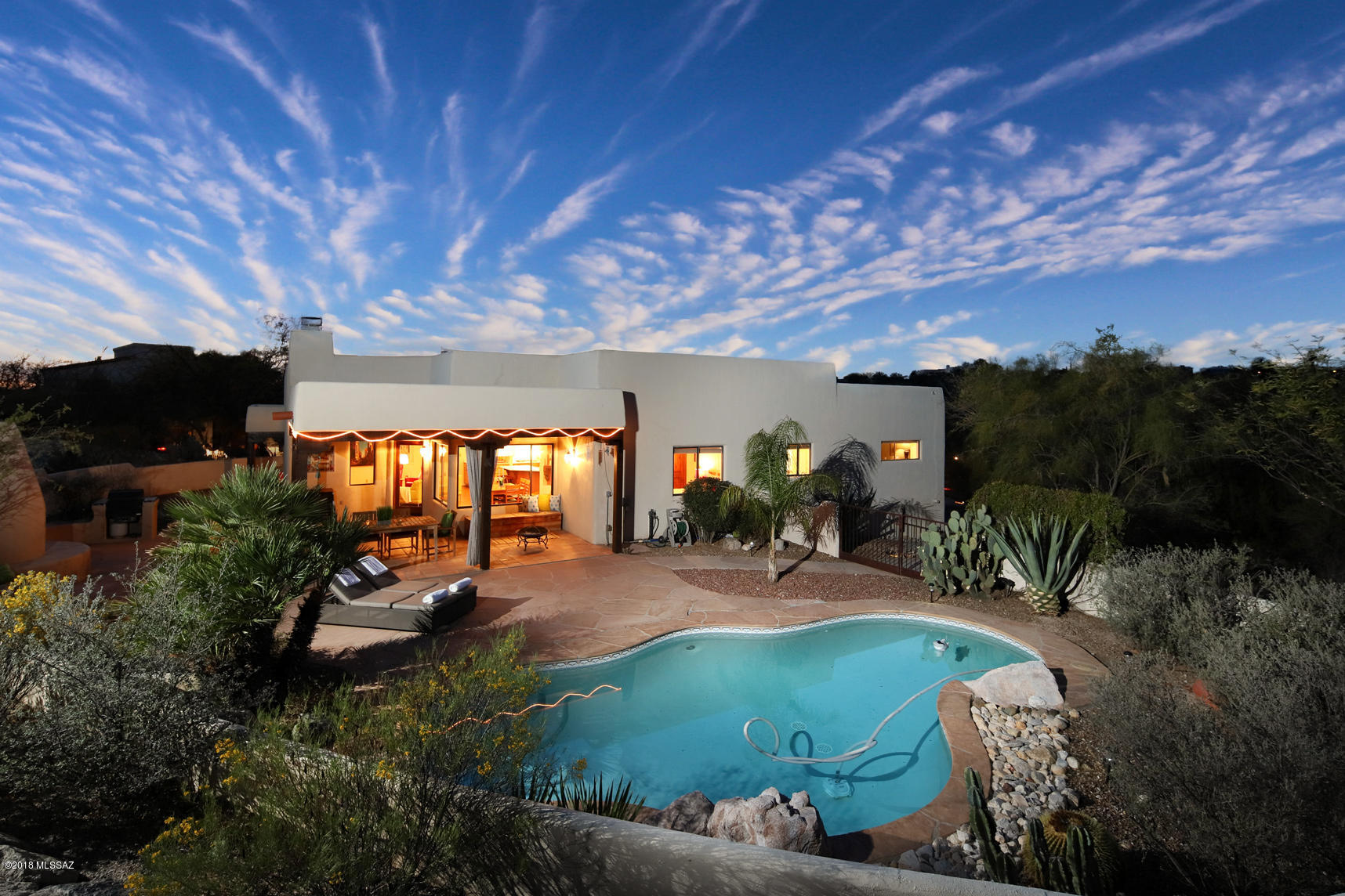 Seller shall entertain and/or counter offers from $510,000 - $525,000.  Get ready to fall in love with this southwestern home nestled in the Catalina Foothills!  Stunning hardwood floors, charming exposed beams and architectural niches await you.  Enjoy the open floor plan where the chef’s kitchen is truly the hub of the home.  Brightened by an abundance of natural light, the property boasts mountains views and comfortable spaces both inside and out.  Relax on the expansive outdoor patio, take a dip in your sparkling pool, and entertain around the cozy beehive fireplace on cool winter evenings. Add panoramic views and you have Tucson outdoor living at its finest!  Take a moment to click on the virtual tour link (under photos) and step inside your new home!