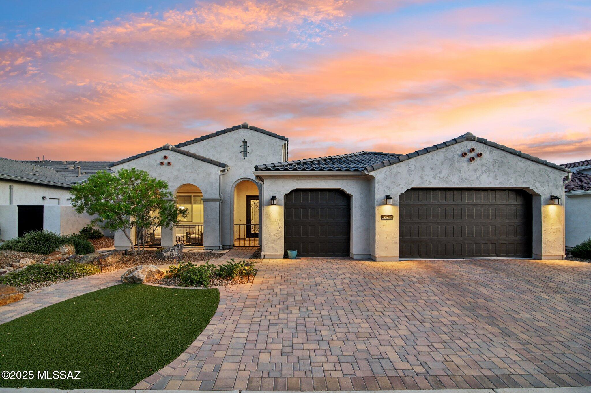 Why wait to build when you can move into your dream home today! This Avalon is a designer home with all the bells and whistles. Situated on a terrific lot backing to a common area with Catalina Mountain views including Mt Lemmon. Custom finishes in a warm color palette give the home a relaxed and comfortable feel. You are greeted by a brick paver walkway and driveway with a wonderful gated front covered patio and custom wrought iron front door.  Home has upgraded French oak LVP flooring in main areas and bedrooms.   Porcelain tile flooring is found in foyer and baths, as well as lighted mirrors.  There are wallpaper accents and decorative touches throughout.  Chef's kitchen w/beautiful, stained alder cabinets, high end quartz countertops, custom pendant lights, and professional Wolf appliances.  Butler's pantry has extra cabinets, sink and undercounter refrigerator plus huge walk in storage pantry. 
The open great room with upgraded built in cabinetry including a wet bar is great for hosting family and friends. Dining room has built in buffet cabinet with designer lighting perfect for entertaining. 
Huge primary suite has a beautiful curbless enlarged shower with dual showerheads, gorgeous vanity, and custom extended walk-in closet. There is a large guest bedroom with ensuite plus extended den/office. Also, a custom mud room is just inside the garage door.
Motorized blinds and custom window treatments throughout the home.
Beautifully landscaped backyard is fully enclosed and includes mature trees, amazing extended outdoor covered patio, contemporary style outdoor fireplace, electric sunshades, and decorative ironwork.  All this backs to a common area for added privacy. Large air conditioned three car garage has upgraded insulation, epoxied floor, tankless hot water heater and a whole house filtration system.   See attached features list for all this home has to offer.
SaddleBrooke Ranch is a premier 55+ active adult community with golf, tennis, pickleball, indoor/outdoor pools, hot tub, fitness center, on-site restaurants, tons of clubs and much more.  This home is not to be missed!