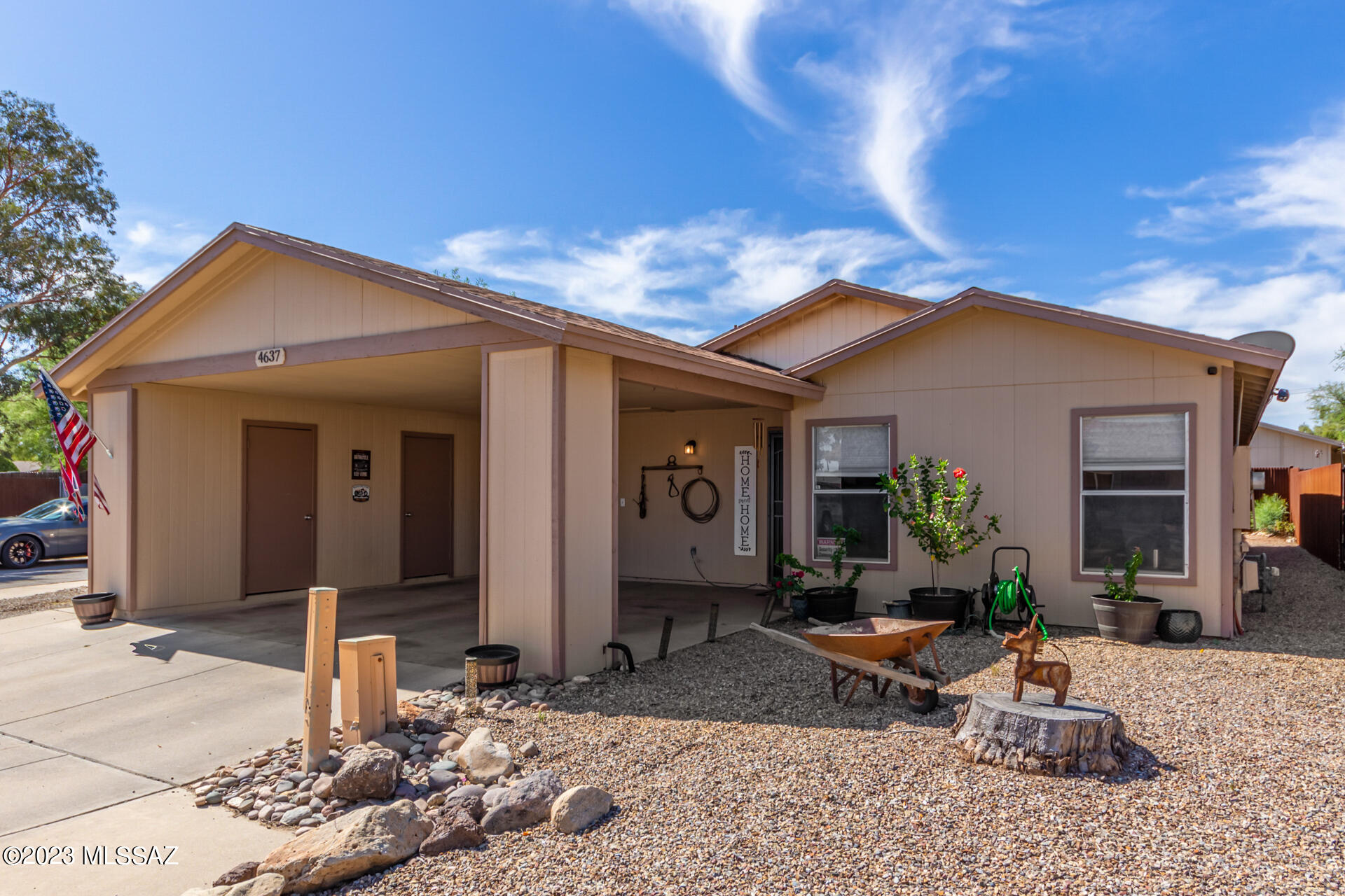 Make yourself at home in this charming 4 bed, 2 bath residence nestled on a quiet cul-de-sac in Tucson! Explore inside to discover a welcoming living area showcasing wood-look flooring, vaulted ceilings, and soothing palette throughout. The impeccable eat-in kitchen boasts white cabinetry, black stainless steel appliances, and a peninsula with a breakfast bar, ideal for casual dining or entertaining friends. Continue to the main bedroom offering a walk-in closet, an ensuite with dual sinks, and private access to the backyard. Outdoors, the property continues to impress with a spacious backyard including a covered patio, perfect for alfresco dining and social gatherings! Don't miss this great opportunity!