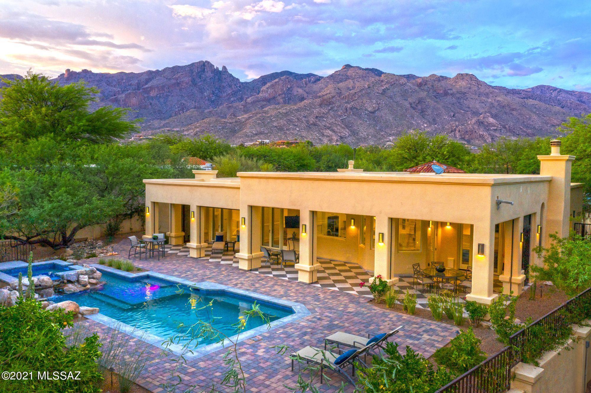 Stunningly beautiful custom home nestled on the most private street with cul-de-sac in Ridge Estates at La Paloma. Completely remodeled interior and exterior with exquisite design features and amenities. Split bedroom floor plan with 3 bedrooms and a den and 2 1/2 bathrooms. Wonderful kitchen, striking floors, high ceilings, built in cabinets and lots of extra features such as a steam shower and heated floors in the master bathroom, surround sound throughout the entire house and security gate monitor. Gorgeous and spacious outside deck with motorized retractable screens overlooking the beautiful pool and spa with waterfall feature and fire pit further back to enjoy those mountain views. Serene patio off the den overlooking the fountain. New kitchen, bathrooms, windows, doors, floors, roof 3 fireplaces, pool, spa, high variable speed HVAC's and water heaters. H2O system. Generous 3 car garage. Handicap accessible.