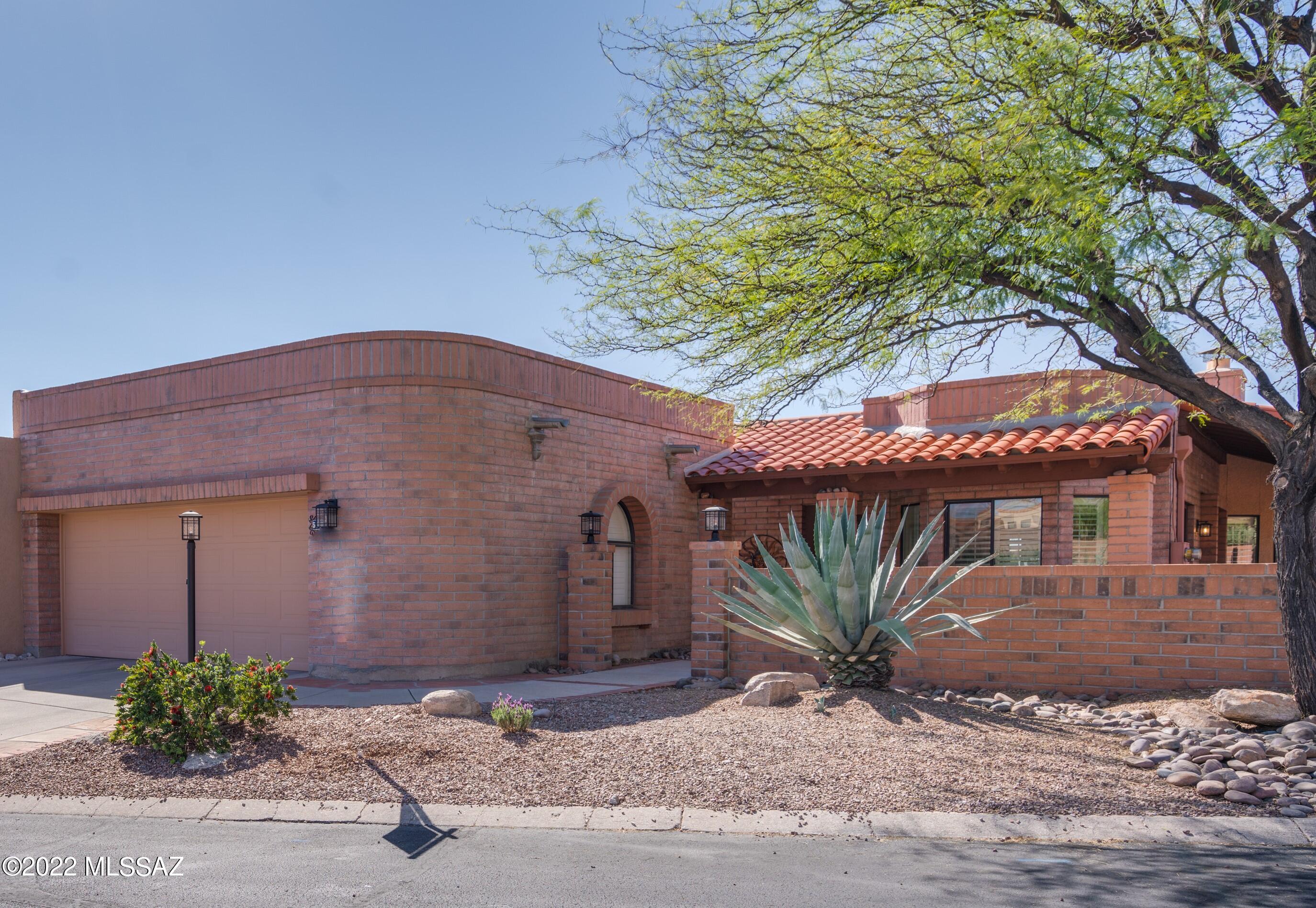 Views on three sides, from the enlarged front courtyard, side & back covered patios & yard. Beautiful modern concrete floors except in bedrooms. Love the lavish primary bath with large shower, stunning granite and new cabinetry, blt-ins in the oversized walk in closet. Newer black appliances, granite in kitchen. Plantation shutters on most windows. High ceilings w/new LED lights in LR/DR with 8 ft sliders out to the views. Cozy/Beehive FP for cooler weather. Beside the 3 bedrooms there is a wonderful office nook off the primary bedroom...both of you can work at home in your own private spaces! This Fairfield community has 2 pools, 2 spas, 2 tennis courts & clubhouse! Welcome home!