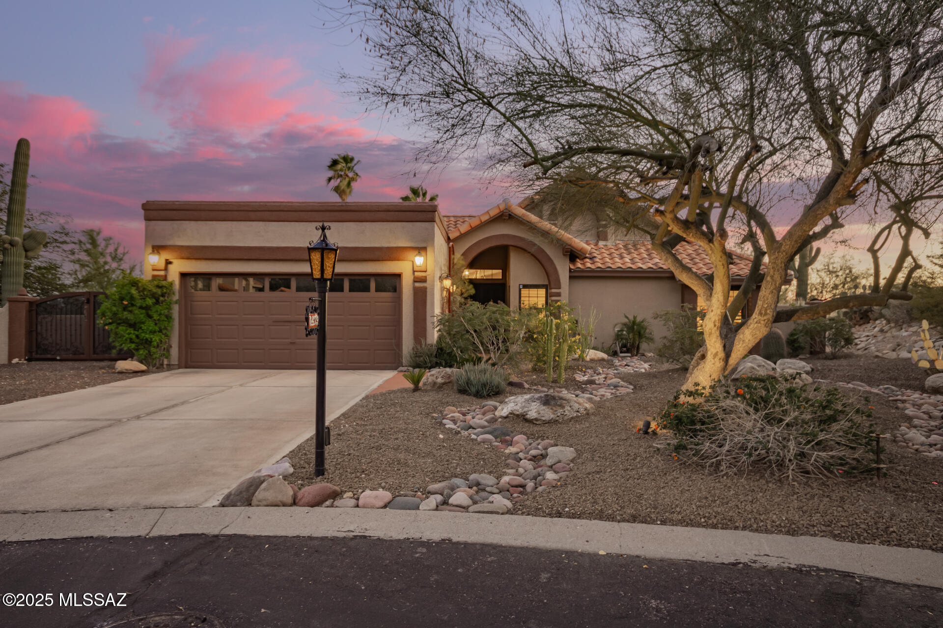 The first thing to impress you about this home is the spectacular location! The view of the mountains driving in never gets old! The home is on a premium lot with expansive views of Sabino Canyon and the Tanque Verde valley. The home includes upgrades too numerous to mention including custom wrought iron front doors and gate; solid wood doors throughout including doors from the Lost Barrio; and a Cantera stone hearth with gas fireplace. The centerpiece of the primary bathroom is a copper soaking tub!  The kitchen comes with a six-burner Dacor gas cooktop, Dacor oven with microwave and warming drawer. The yard is landscaped meticulously with unique plants, rock accents and landscape lighting complete with resurfaced pool and spa. Live everyday like it's a vacation in this stunning place Seller is owner/agent.