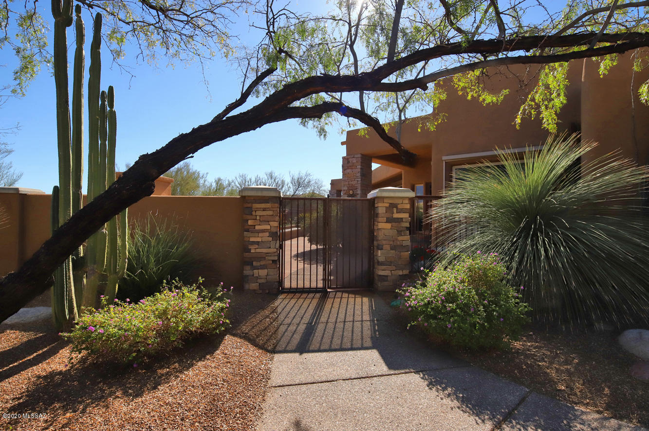 VIEWS, Hilltop Lot, Privacy, SW Contemporary, Gourmet Kitchen and Elegant Interiors -- This house has it all and is perfectly situated in the heart of popular Coyote Ridge. Open and spacious great room with fireplace and oversized picture windows that frame the stunning views. Gourmet kitchen will delight any cook and features island, alder cabinets, granite, walk-in pantry, custom built-in desk, wine cooler & breakfast nook.  Privacy galore with front & back patios--spa, fireplace & firepit, fruit trees, built-in bbq, fountain & more. Spacious owners suite w/sitting area & luxurious bath. Energy efficient solar panels  save you hundreds of dollars monthly. Office/den with custom built-ins next to owner's suite.  See add'l Feature Sheet in document section for full details and information.