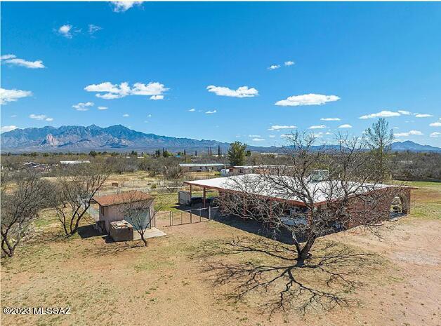 Completely renovated in 2020, this Southwestern ranch-style home sits on very useable 2.5 acres, zoned for horses, with a private well. Nestled in a quiet neighborhood, near the Sopori School, community park and pool. Dazzling mountain views from the dining area, rear patio or while relaxing in the hot tub. The beautiful slate fireplace wall captures your attention as you enter the great room. The entire home has tile floors, a new kitchen with granite counters, Pella windows, and a laundry room conveniently located in the master suite. A unique adobe wall parallel to the street and perimeter fencing provide privacy. A backyard chain-linked fenced area keeps your pets safe. The concrete floor 168sf storage shed can easily serve as a workshop.