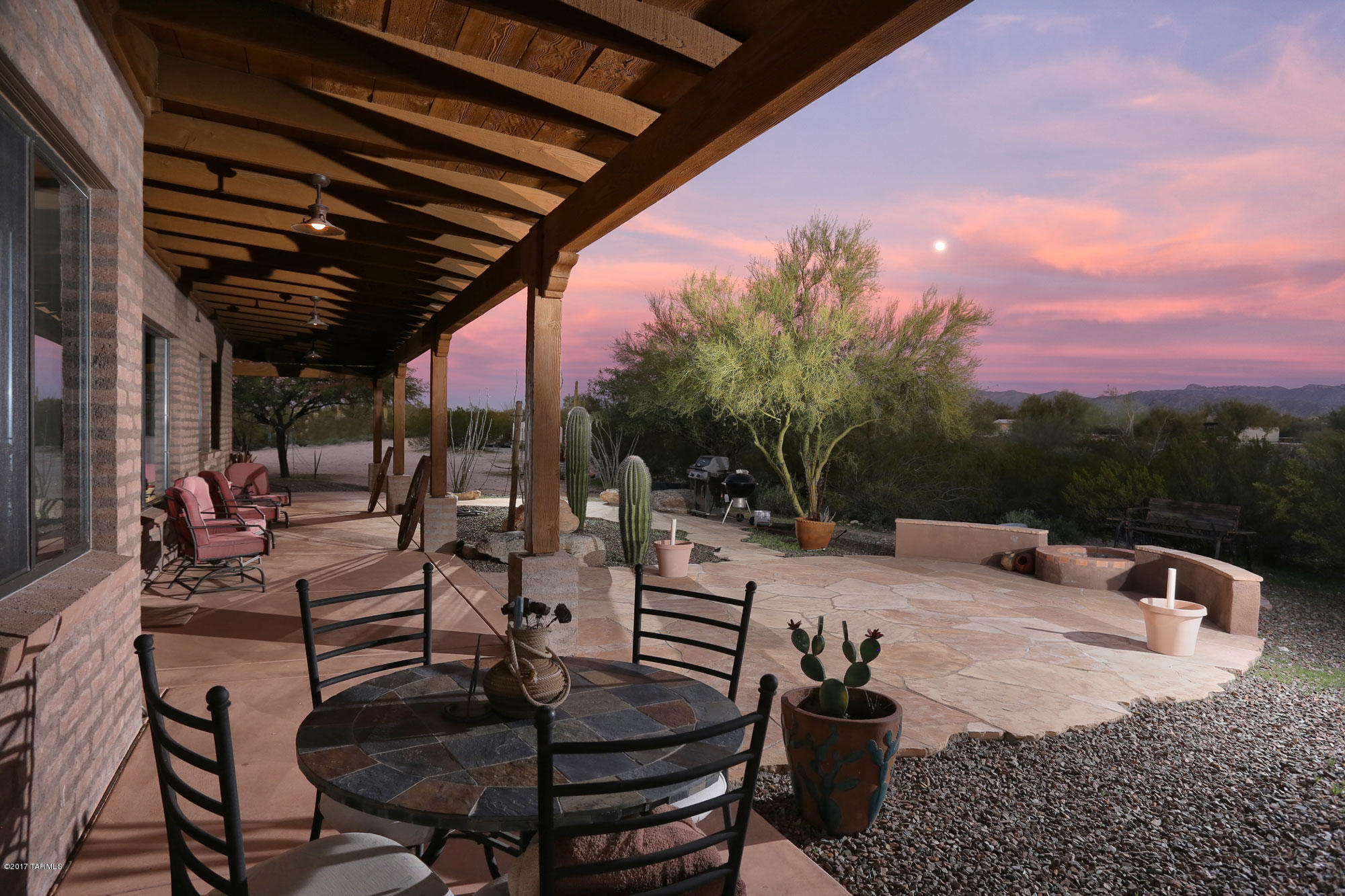 15.81 acres adjacent to Federal Land with the most charming ranch house ever! Full porches, lots of windows, solid slump block construction, colored concrete floors! The classic Sonoran desert setting with many huge Saguaros, a forest of Mesquite Trees, barrel, cholla, prickly pear! Home sits on beautiful natural rise/hill. Horse facilities include 140 x 240 Arena,16 x 24 tack room w/shower/toilet, sink & hookup for washer/dryer. Separate full RV hookup. Private water well! Great opportunity for animal and horse enthusiasts! Internet available and home is within 15 minutes of the I-10 Marana Exit or Red Rock Exit to Phoenix! Privacy galore, peaceful setting, relaxing life!
