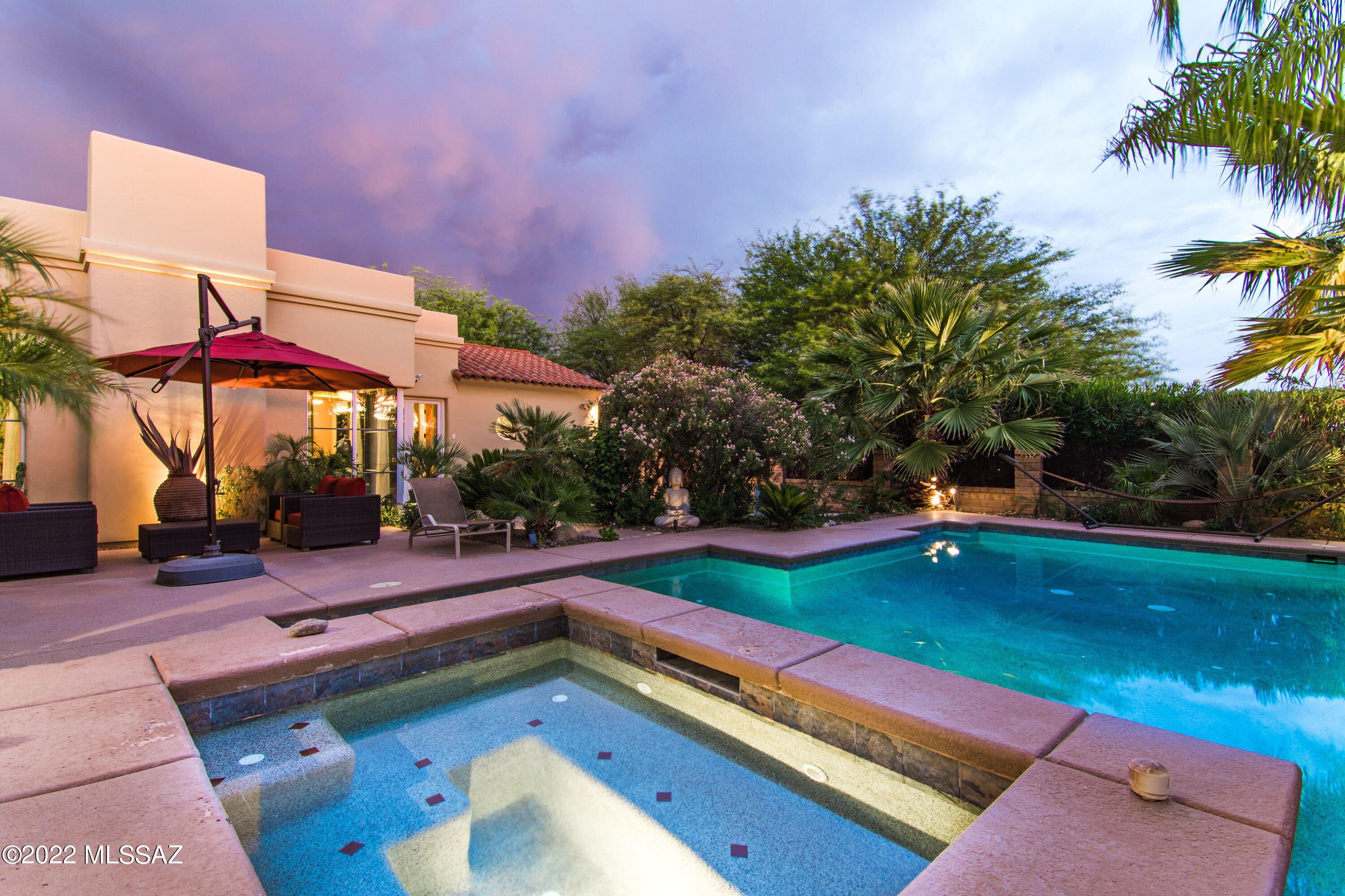 An elegant home on over an acre with city, mountain, and sunset views. The spacious great room features a bright and open floor plan with views of the yard with pool and spa. The kitchen features two islands with granite counters, and lots of storage, A large breakfast nook, and is adjacent to the family room with a  casual living space. The primary bedroom is a retreat with a spa like ensuite. Three guest bedrooms and two baths. Resort style backyard with pool and spa to enjoy the views.