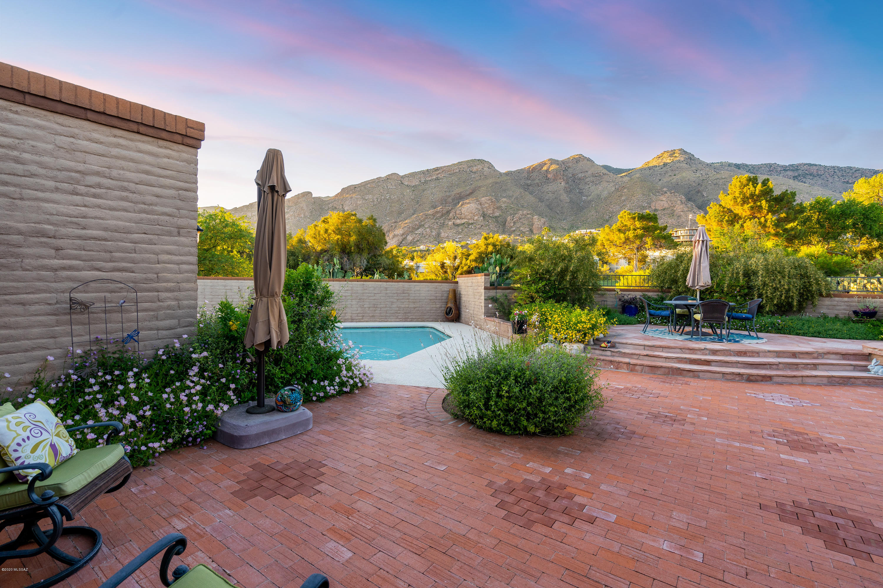 Welcome Home! This beautifully updated Skyline County Club home is what you've been looking for.  From the tasteful features throughout to a backyard designed for relaxing and entertaining to the jaw-dropping mountain views, this home has it all.  A formal living room and dining room, 4 bedrooms, a huge walk-in closet in the owner's suite, and so much more. Split bedroom plan with an on-suite bath so your guest can be comfortable while on the other side of the house. All you need to do is pour yourself a beverage of your choice and sit back relax in your new home.