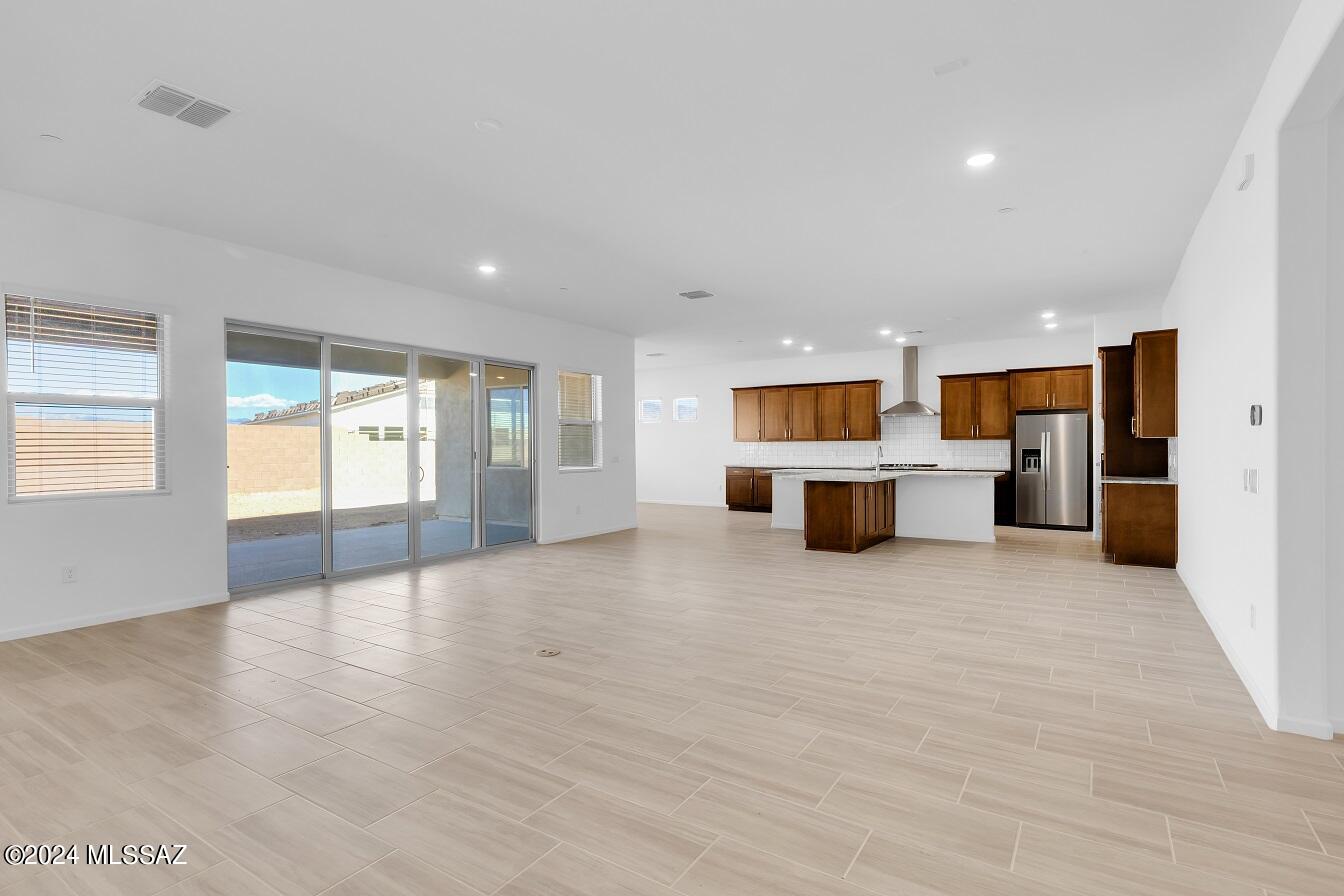 Gorgeous Mint plan with Desert Modern elevation. This exquisite home showcases 4 generously-sized bedrooms & 3.5 stylish baths. Coffered ceiling at foyer adds elegance & charm. Upgraded gourmet kitchen is a true masterpiece, featuring Refrigerator, 36'' gas cooktop & beautiful granite countertops. The open floor plan is perfect for entertaining, with a 12' centered sliding glass door that leads to a private backyard. Teen room provides additional space for relaxation or recreation. Laundry area includes Washer/Dryer, cabinet w sink. 4-car tandem garage is complete with Epoxy coating. Located on a cul-de-sac, this home is designed to meet all your needs.