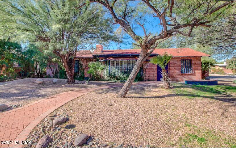 Absolutely adorable house with a lot of charm! 3 bed, 2 ba, completely redone kitchen! Gorgeous cabinets, counter tops and appliance. East in kitchen plus a bar for eating. AZ room that looks out to a darling patio/yard. Beautiful scored concrete floors throughout. parking in the back of the property.
