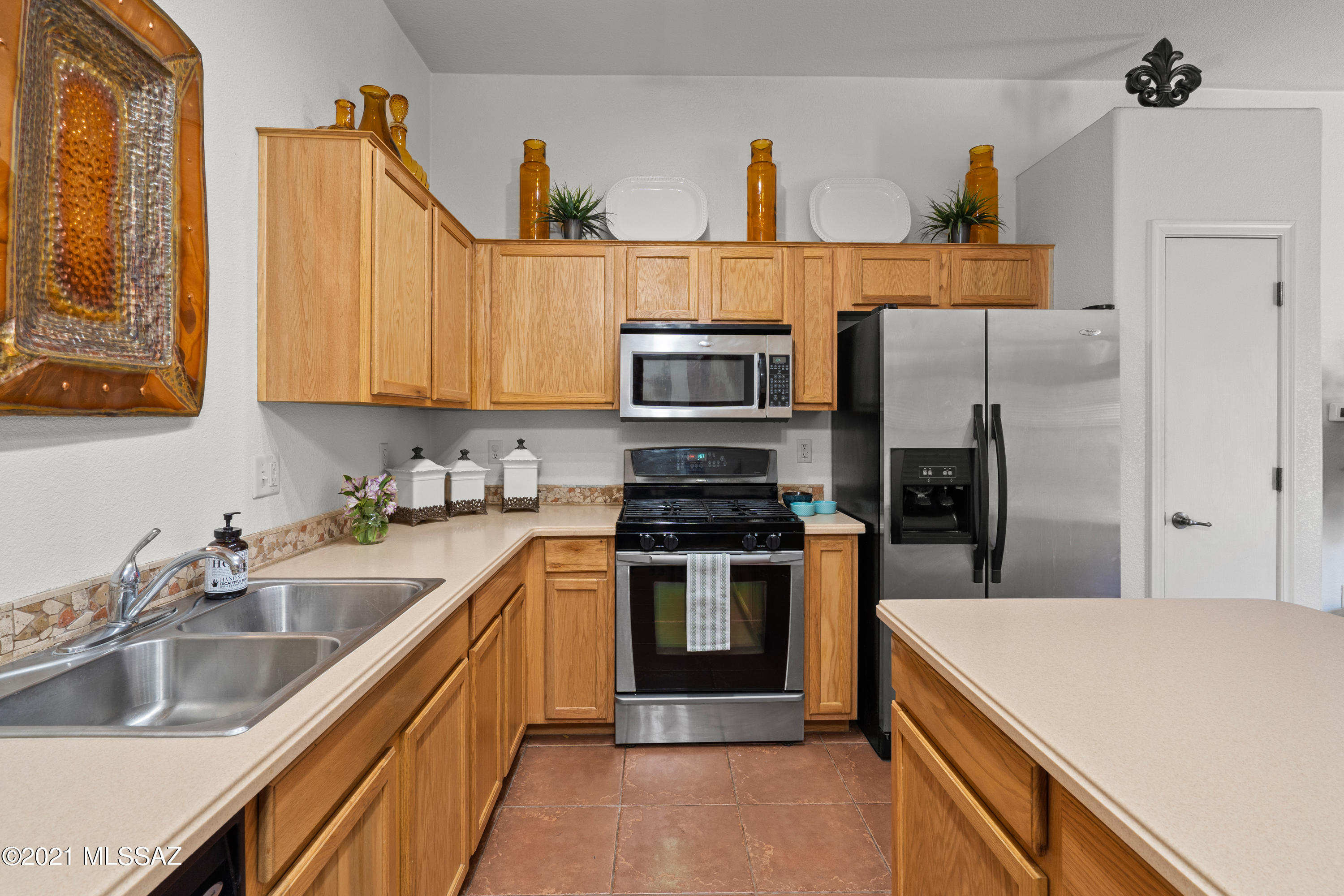 Charming 2 bedroom 2 bath townhome in the desirable community of Tres Pueblos. Open concept floorplan with lots of storage. Gorgeous tile throughout main living area with accenting tile work in kitchen and bathroom. Large backyard with plenty of room to make it your own!!! Conveniently located close to schools, community park, shopping, and access to I-10. One of the Sellers is a licensed real estate agent in the State of Arizona.