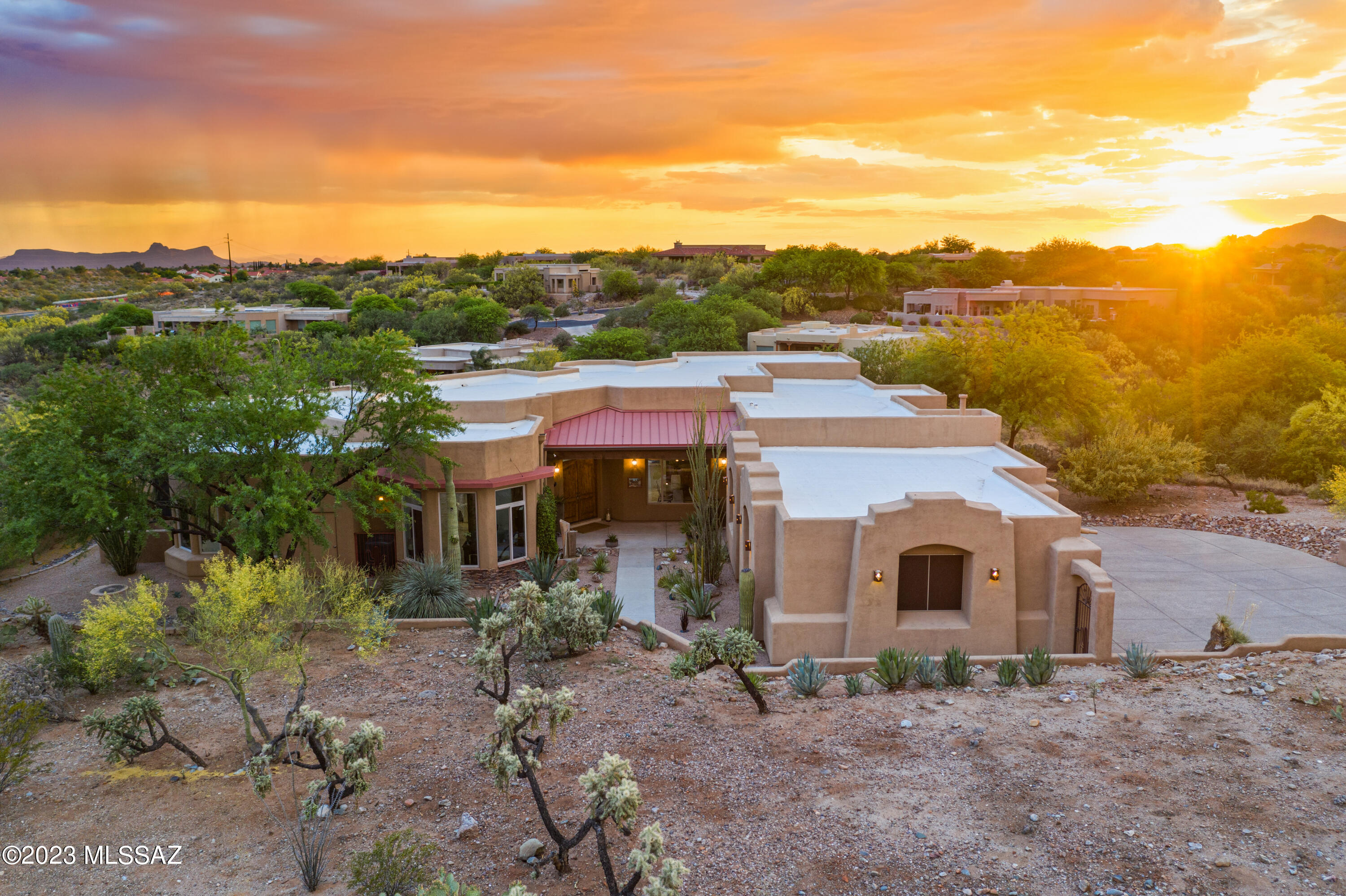 Tranquility abounds in this custom designed and built home by Jack Turbyfill in the coveted Coyote Ridge subdivision.  Enjoy the stunning sunrise and sunset views from the comfort of your pool, city lights while entertaining in the evening in this glorious backyard. Imagine waking up to coffee on the front patio watching the sunrise and, in the evening, enjoying the marvelous Arizona sunsets while lounging in your backyard. Every night is a wonderful night for a moon dance in this home, watching the moonlight bring the Cholla cactus to life. More than a home, this is the sweet desert lifestyle. Amazing pool, waterfall, and spa. Multiple outdoor areas to relax or entertain family and friends.  Come enjoy the paramount of Tucson living.