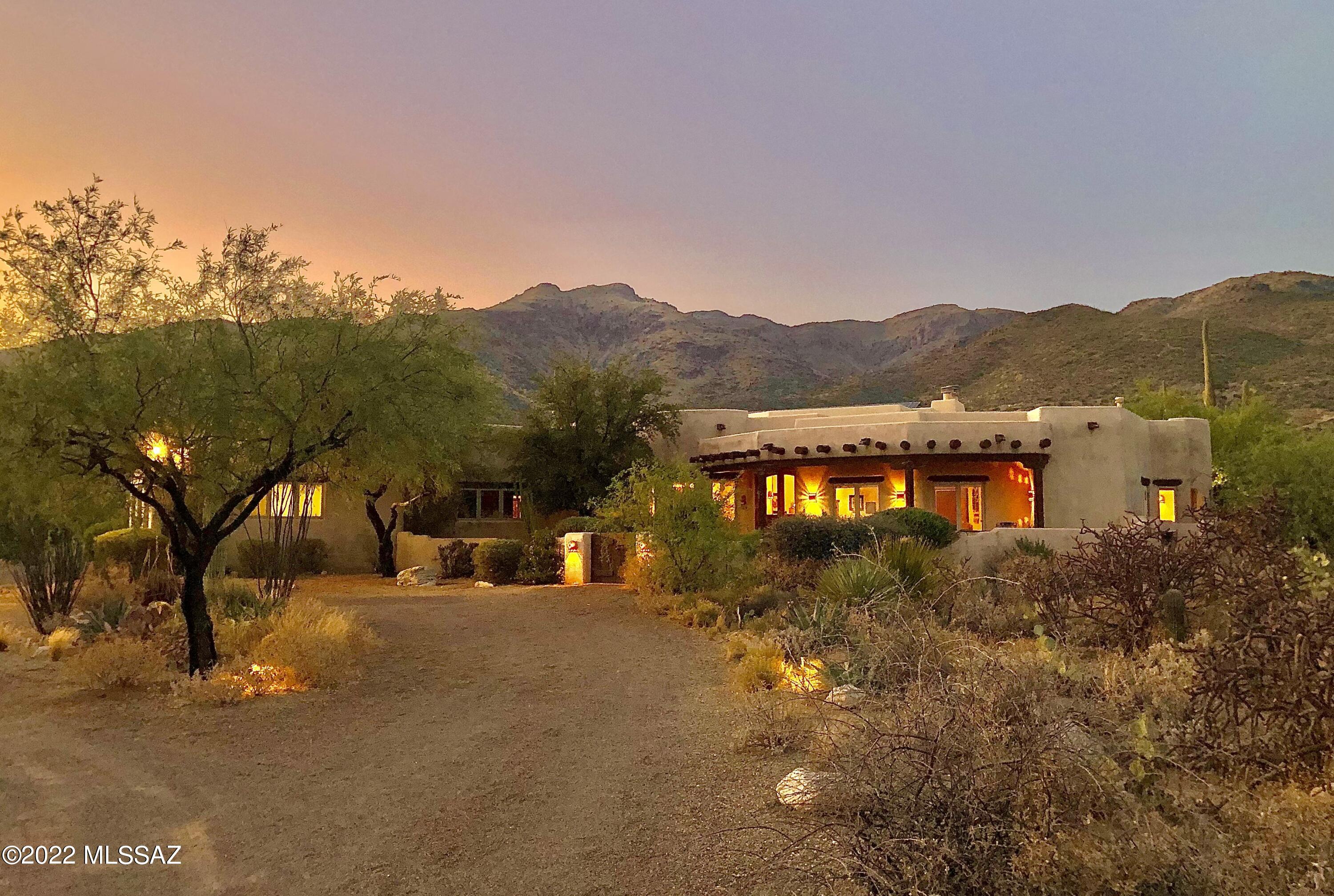 Premier-quality Santa Fe style home at the base of Mt. Lemmon! Constructed by Tucson's award-winning builder Ray Birch, known for authentic one-of-a-kind dream homes with extreme attention to every detail. PLEASE SEE EXTRA DESCRIPTION UNDER DOCUMENTS!!! Unique custom features. Coved and ribbed ceilings, viga beams, Saguaro ribs, skip-peeled latillas, 4 kiva fireplaces, Saltillo tiles, Mexican tile accents in kitchen & bathrooms, Imperial plaster walls, custom cabinetry & vanities, jetted tub, walk in showers, gourmet kitchen, cozy breakfast area and dining room, exercise room, office, 3 car garage. Single level home on 3.34 acres horse property. Multiple private patios, 40'x14' heated lap pool, spa, outdoor kitchen, mature Saguaros and trees, low care desert plants. OWNED SOLAR PANELS! Near to fabulous cycling and hiking trails. Owned Solar System.
Please take a look for detailed description of this beautiful home in the Documents Section.


THE PROPERTY

Ø	3.34 acres horse property at the base of Mt. Lemmon
Ø	Breathtaking picturesque Catalina and Rincon Mountain views 
Ø	Designed and built in 2003 by award-winning builder and architect Ray Birch, famous for authentic high-quality Santa Fe style homes
Ø	Daily exquisite sunrise and sunset views
Ø	Natural desert vegetation including many mature Saguaros
Ø	Quiet and serene, despite being only minutes from city life
Ø	In the heart of Tanque Verde Valley with numerous fabulous cycling trails, great for birdwatching, hiking, and a healthy lifestyle 
Ø	Beautiful home for entertaining  can accommodate large social events
Ø	Upscale, quiet neighborhood
Ø	3-coated frame stucco
Ø	Hand troweled Imperial plaster walls
Ø	Oversized 3-car garage with built in storage cabinets 
Ø	Central vacuum etc.


THE HOME

Ø	Special attention to every detail
Ø	Inviting front yard with old Mesquite tree and cactus garden with water feature 
Ø	3,760 Square feet of living space
Ø	4 bedrooms and 5 bathrooms (3 full bathrooms, 2 half bathrooms)
Ø	Santa Fe style ceiling treatments including exposed wood, Viga beams, skip peeled Latillas, Saguaro ribs 
Ø	Knotty Cedar solid wood cabinetry with Saguaro ribs accents
Ø	Solid wood doors throughout the entire house 
Ø	Exterior French doors
Ø	Saltillo tile flooring 
Ø	Great room with 14 feet high ceilings 
Ø	Each bathroom has its own unique theme created by Mexican Talavera sinks and exclusive inlayed Mexican tiles
Ø	3 gas Kiva fireplaces 
Ø	Large laundry room with many cabinets


IN THE KITCHEN

Ø	Gourmet/Chef's kitchen
Ø	Extensive counter space with gorgeous Mexican tile accents
Ø	Large center island 
Ø	Large walk-in pantry
Ø	Built-in desk
Ø	Formal dining area with built-in buffet and wet bar with Saguaro ribs cabinet doors


MASTER SUITE / MASTER BATH

Ø	Spectacular mountain views
Ø	Master bedroom with Kiva fireplace 
Ø	Jetted jacuzzi tub
Ø	Large walk-in shower with 3 shower heads
Ø	Separate vanities
Ø	Large walk-in closet
Ø	Mexican tiles and Saltillo tiles 
Ø	Vaulted ceilings (12 feet high)


BACKYARD 

Ø	Unobstructed gorgeous mountain views
Ø	Full length Saltillo tiled rear covered porch
Ø	Outdoor kitchen with BBQ 
Ø	Beautiful 40 x 14 feet lap pool with large sunbathing and seating area 
Ø	Wood burning beehive fireplace 
Ø	Elevated spa
Ø	Completely landscaped with low care desert plants and cacti
Ø	Old Grapefruit tree in the Western corner


SOUND / MUSIC SYSTEM

Ø	The house is wired for sound so that from a CD player or other music source, can be directed to each of the front bedrooms, the great room, the kitchen, and to the outside patio. Each room has a control for volume. 

EXTRAS 

Ø	Workout room / gym 
Ø	Large office room or family room or billiard room
Ø	OWNED SOLAR PANELS