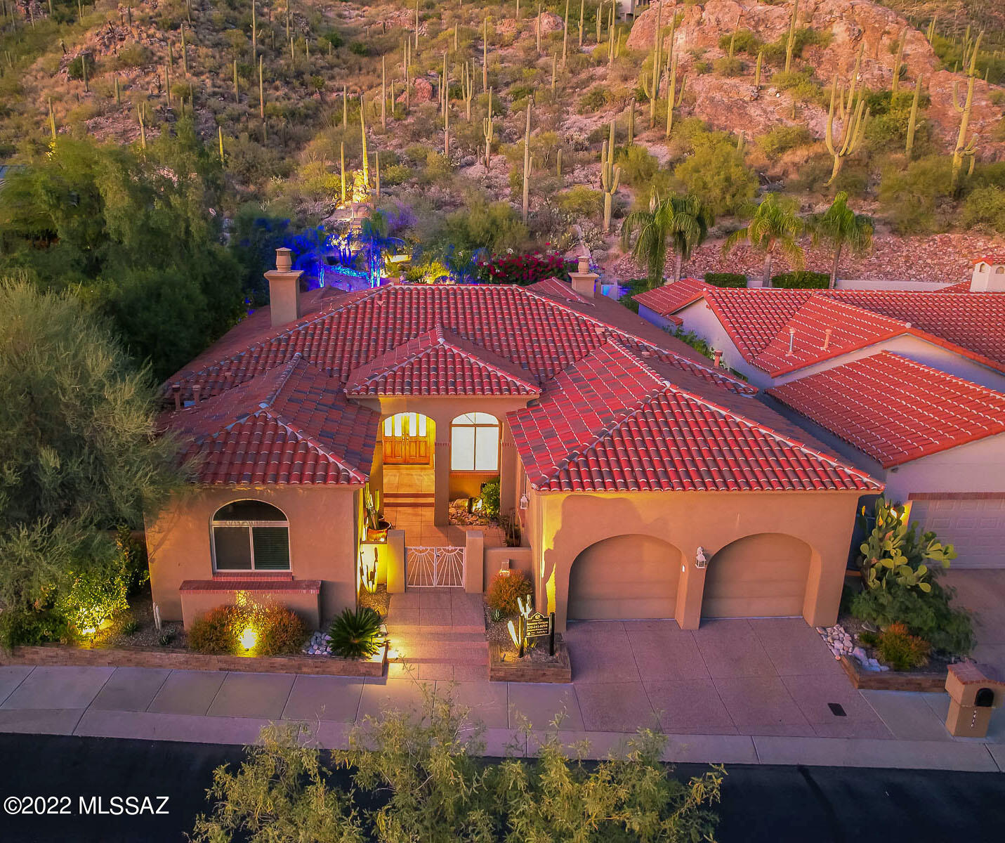 Located in prestigious gated Ventana Canyon Country Club, this  David Baird all masonry designed home is sited on premium lot to capture expansive mountain views from spacious backyard with pool/spa & fire pit.   The backyard is a true resort-like retreat w/an elevated spa that cascades into pool. Enter home through private courtyard to foyer with vaulted ceilings , marble & wood flooring throughout.  Kitchen  boasts tons of natural light, custom cabinets , wine fridge & center island that serves as the focal point for entertaining.  The immense primary suite features duel fireplace,  den/office/exercise area w private door to patio & generous walk-in closet off of bath. Family  room & dining room are adjacent to kitchen that create more intimate spaces to entertain guests & family.