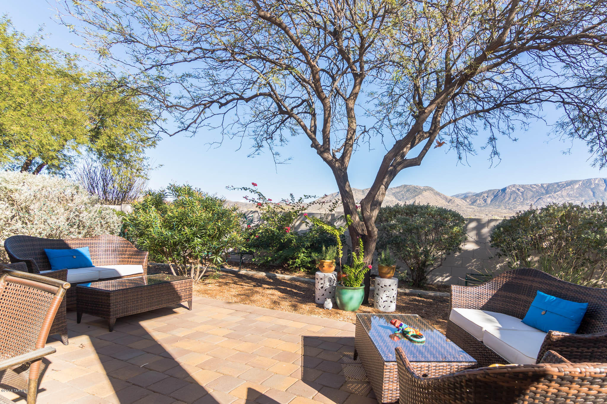 This is it! A Naples Villa with direct views of the Catalina Mountains! Our villa offers a split floor plan with 2 bedrooms, 2 bathrooms, a separate den and an additional sitting or dining room area. The great room layout works w/cathedral ceilings, 2 sets of sliding glass doors and UV/privacy screens on the windows. The East facing paver patio has been extended and is gorgeous living space with amazing mountain views.