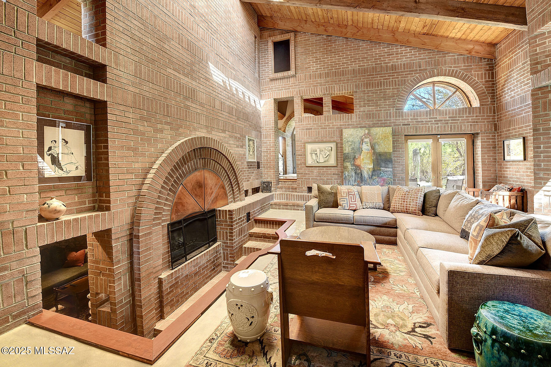 A Rare Architectural Gem with Timeless Elegance.  Designed by esteemed architect David Wilson, this extraordinary property is a true masterpiece, drawing inspiration from the legendary Frank Lloyd Wright. Nestled on just under an acre, the main home and guest house showcase exceptional craftsmanship, thoughtful design, and a deep connection to nature. 

From the moment you arrive, the meticulously designed grounds invite you inâ''multiple patios, enchanting gardens, and serene sitting areas create an oasis of tranquility, perfect for relaxation and outdoor enjoyment.

Inside the main residence, every space tells a story. Three well-appointed bedrooms, each with private patios, provide a seamless blend of indoor-outdoor living. Two beautifully designed bathrooms accompany the home, along with two remarkable bonus spaces: an inviting upstairs library with built-in bookshelves and a cozy bench, perfect for hours of reading while taking in breathtaking nature views through floor-to-ceiling windows. The second space is a truly unique rock alcove with built-in seating and a private exterior entrance, ideal as a wine room, poker lounge, intimate TV den, or meditative retreat.

A hallway like no other, featuring a mesmerizing brick barrel ceiling, leads you into the living room, an architectural marvel with soaring 20-foot wood-beamed ceilings, unexpected peek-a-boo windows, and strategically placed openings that create a sense of wonder. A custom copper-arched fireplace takes center stage, complemented by French doors that open to the outdoor sanctuary. Overhead, a large skylight with an electric shade bathes the space in natural light, enhancing its inviting ambiance.

The kitchen and dining area continue the theme of warmth and sophistication, featuring rich hardwood flooring, dual islands, granite countertops, solid wood cabinetry, stainless steel appliances, and a sliding glass door leading to an outdoor dining patio. Floor-to-ceiling windows frame breathtaking mountain views, golden sunsets, and serene garden spaces.

The thoughtfully designed hall bath showcases a custom cherry vanity with a stunning leathered granite countertop, a beautifully tiled backsplash, designer lighting, a decorative mirror, and elegant marble flooring leading to a luxurious tiled shower surround.

A Resort-Inspired Primary Suite.
The private primary wing offers a retreat unlike any other. At the end of the hall, French doors open to a private patio, setting the stage for ultimate relaxation. The walk-in closet boasts custom shelving, while an additional flex space can serve as a second walk-in closet, office, or storage area.
The bedroom itself exudes warmth and character, with tall wood-beamed ceilings, built-in shelving, a charming fireplace, and private French doors leading to an extended deck with handcrafted railings. The outdoor soaking tub offers a spa-like experience under the open sky, creating a truly indulgent escape.
The en-suite bath is a showstopper, featuring a custom floating vanity with a marble countertop and integrated sink, and an oversized walk-in shower with a stunning brick barrel ceiling illuminated by integrated starlights. A rain showerhead, additional handheld shower, arched window with breathtaking mountain views, and exquisite designer tile work complete this one-of-a-kind space.

Incredible 707 Sq. ft. Guest House - A Home Within a Home.
Completely transformed in 2023, the guest house is a light-filled haven with soaring ceilings and impeccable design. The open-concept kitchen and dining space seamlessly flow into the bedroom or flexible living space. The elegant bathroom features a decorative tiled walk-in shower, custom vanity, designer lighting, and charming built-in nooks. A modern metal and wire railing staircase leads to the inviting loft-style bedroom, while the private walkout deck offers stunning views and a serene sitting area, perfect for morning coffee or evening entertaining. Whether used as a private retreat for guests or a lucrative Airbnb opportunity, this space is truly a standout.

The Perfect Balance of Seclusion & Convenience.
This exceptional property offers the feeling of a private retreat while being just moments from everything, centrally located in the desirable North area, with easy access to shopping, dining, downtown, and the freeway. Experience the beauty of nature, the artistry of architecture, and the comfort of a warm, welcoming home, all in one remarkable property.