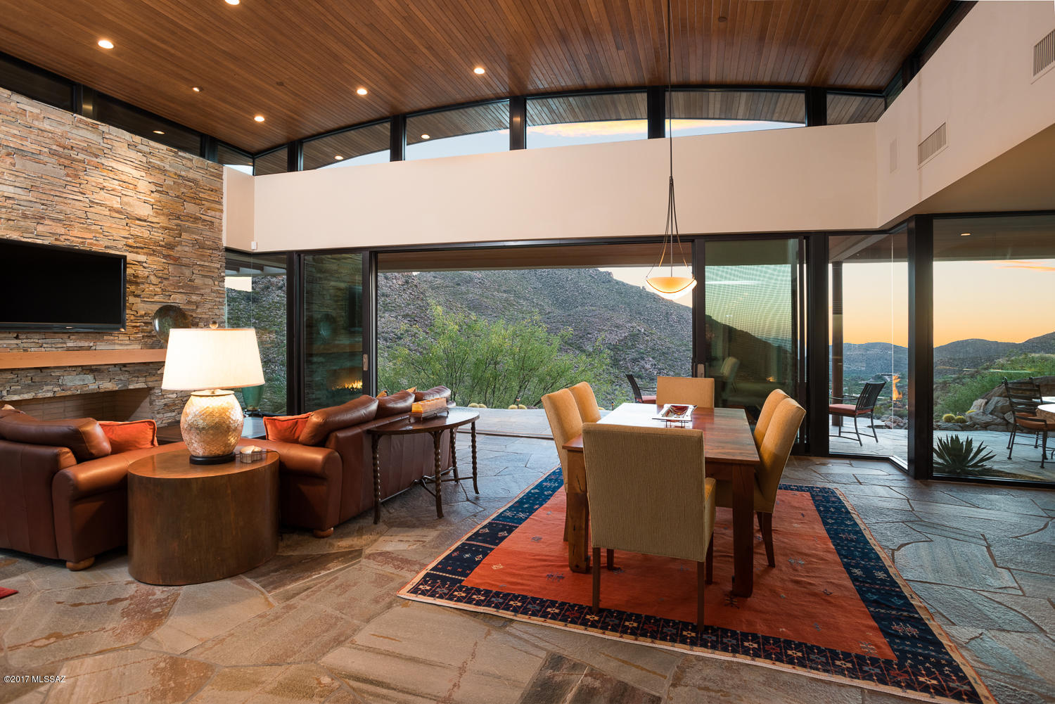 Perched high on private 2.6 acre lot in guard gated Canyon Pass, exquisite 3,678sf 3BR/3½BA custom home designed by renowned architect Ron Robinette & built by Mark Alan Construction offers privacy, mountain range panoramas & incredible sunset views. Unparalleled quality & built to perfection w/utmost respect for the natural beauty of saguaro covered Tortolita Mountains. Masonry constructed w/stacked stone accents featuring Quartzsite flooring, stacked stone fireplace & Subzero/ Wolf appliances. Two large guest suites each w/full bath, closet & private patio. Enjoy natural rock outcroppings & access to hiking & biking trails meandering through Dove Mountain & surrounding Preserves. Experience 81 Holes of Desert Golf w/nearby Highlands at Dove Mountain, Ritz-Carlton & Gallery Golf courses.