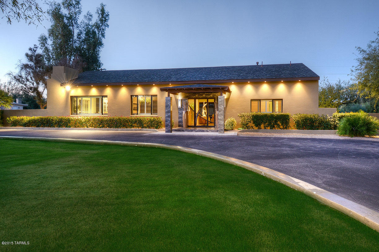 ***EXCEPTIONAL VALUE IN TUCSON COUNTRY CLUB*** NO DETAIL HAS BEEN OVERLOOKED IN THIS 4,879 SQ FT CONTEMPORARY, SITED ON OVER 3 ACRES. COMPLETELY CUSTOM FROM INCEPTION & REMODELED FROM THE GROUND UP IN 2010. CRAFTSMANSHIP & QUALITY ARE A CONSISTENT THEME, DELIVERING BOTH COMFORT & STYLE. THE EXPANSIVE OPEN & SPLIT BDRM PLAN, WITH STUNNING GLASS RETRACTABLE WALLS THAT DISAPPEAR TO CREATE A SEAMLESS INDOOR/OUTDOOR FLOW, IDEAL FOR ENTERTAINING. GENEROUS EAT-IN CHEF’S KITCHEN W/ BROOKHAVEN CUSTOM CABINETRY, THERMADOR BUILT-IN FRIDGE/FREEZER, 2 BOSCH DISHWASHERS, DECOR COOKTOP & DOUBLE OVEN, W/ LARGE CENTER ISLAND & BREAKFAST BAR. THE GENEROUS MASTER SUITE IS COMPLETE W/ LARGE WALK-IN CLOSET, SPA-LIKE BATH, DOUBLE VANITY & OVERSIZED SHOWER. THIS HOME IS THE IDEAL BLEND OF TASTE, STYLE & LUXURY