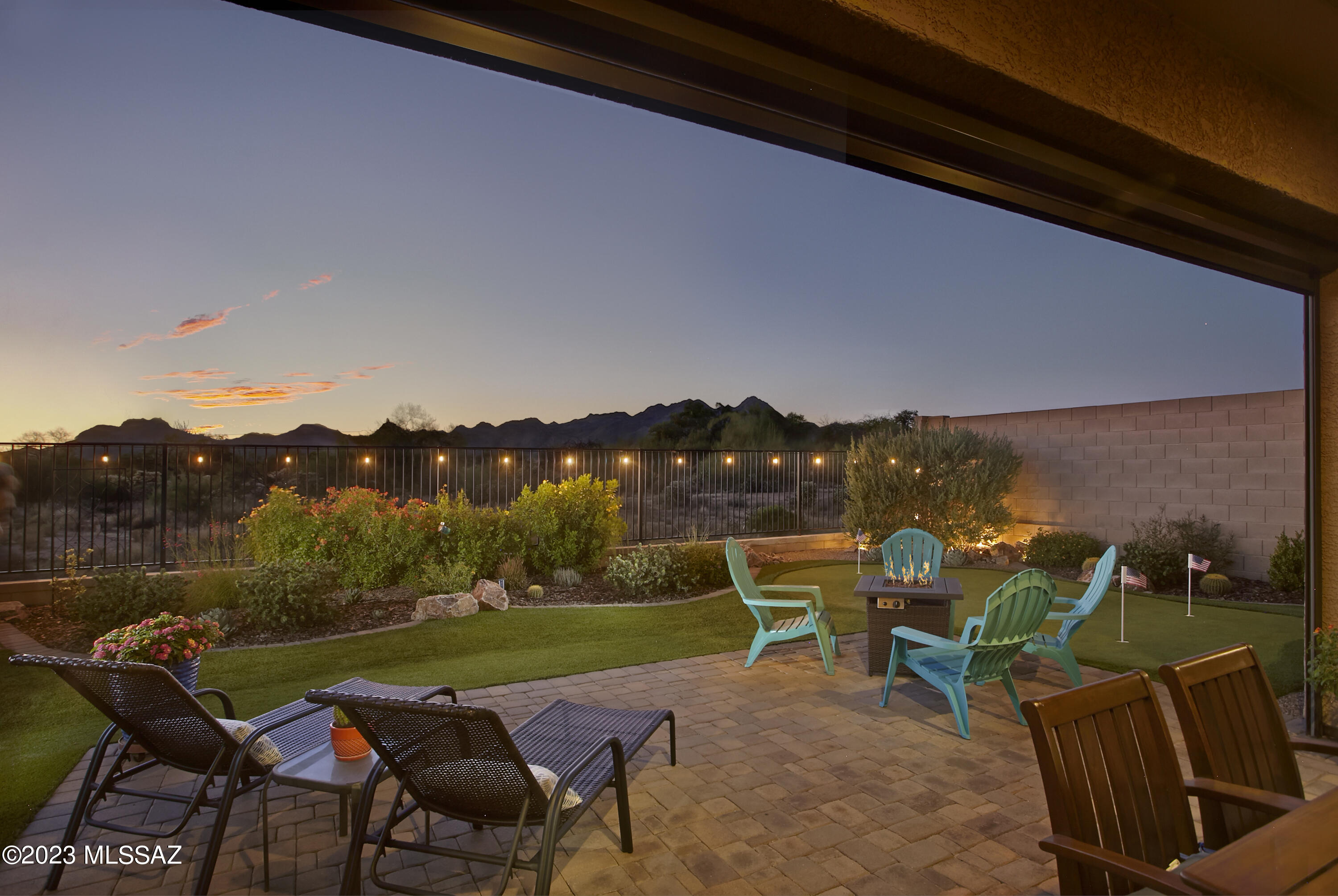 Bordering a nature preserve in Center Pointe at Vistoso, 13671 N Meadowhawk Lane offers a turn-key residence in a gated community with excellent amenities.  Built in 2017, this single-story residence includes 4 bedrooms (2 on either side of the home), 3 full baths, plus a dedicated office and separate bonus room. Prominent views of the Tortolita Mountains anchor the open concept great room and breakfast nook.  The chef's kitchen includes granite counters, double ovens, stainless appliances, a gas cooktop, extended cabinetry, reverse osmosis filtration, and a spacious pantry. Living space comfortably extends outdoors with a gated front courtyard and covered back patio that includes a new electric solar screen. Fully landscaped, including a putting green, the low maintenance backyard sits next to designated open space with exposure to both colorful sunsets and mountains.

Within the neighborhood, residents enjoy a variety of amenities for an active and social lifestyle. The community center includes a 25-meter pool, in-ground spa, splash pad, BBQ grill with seating, and a lounge area with a cozy fireplace. There is also a spacious indoor kitchenette for meetings or events. Beyond the community center, there is a playground, covered ramadas with picnic tables, walking paths and access to the 6.2-mile paved Vistoso Trail.

Within a short radius, there are multiple schools, parks and a plaza with a grocery store and shops. An excellent bike lane is immediately available, connecting to "The Loop" 135-mile paved multi-use path.  Oro Valley Hospital complex and medical plaza is within 10 minutes, as well as world-class hiking trails at Catalina State Park, 20+ miles of mountain biking trails at the Big Wash Trailhead, and the Oro Valley Marketplace with a variety of dining, retail & movement studios.